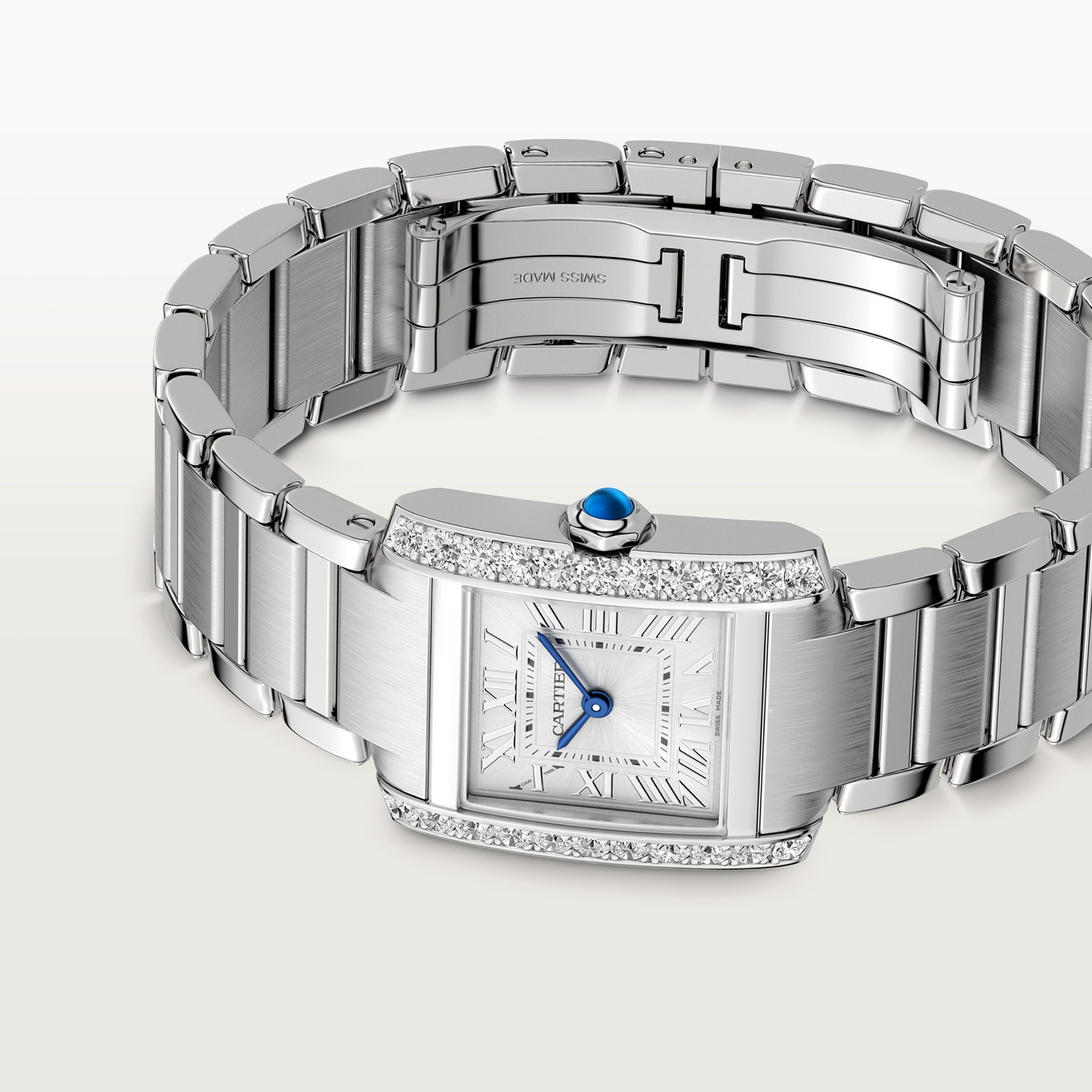 Top view of a Dupe Tank Française small model watch with the bracelet open, displaying the diamond-set steel case, dial, and inner clasp structure.