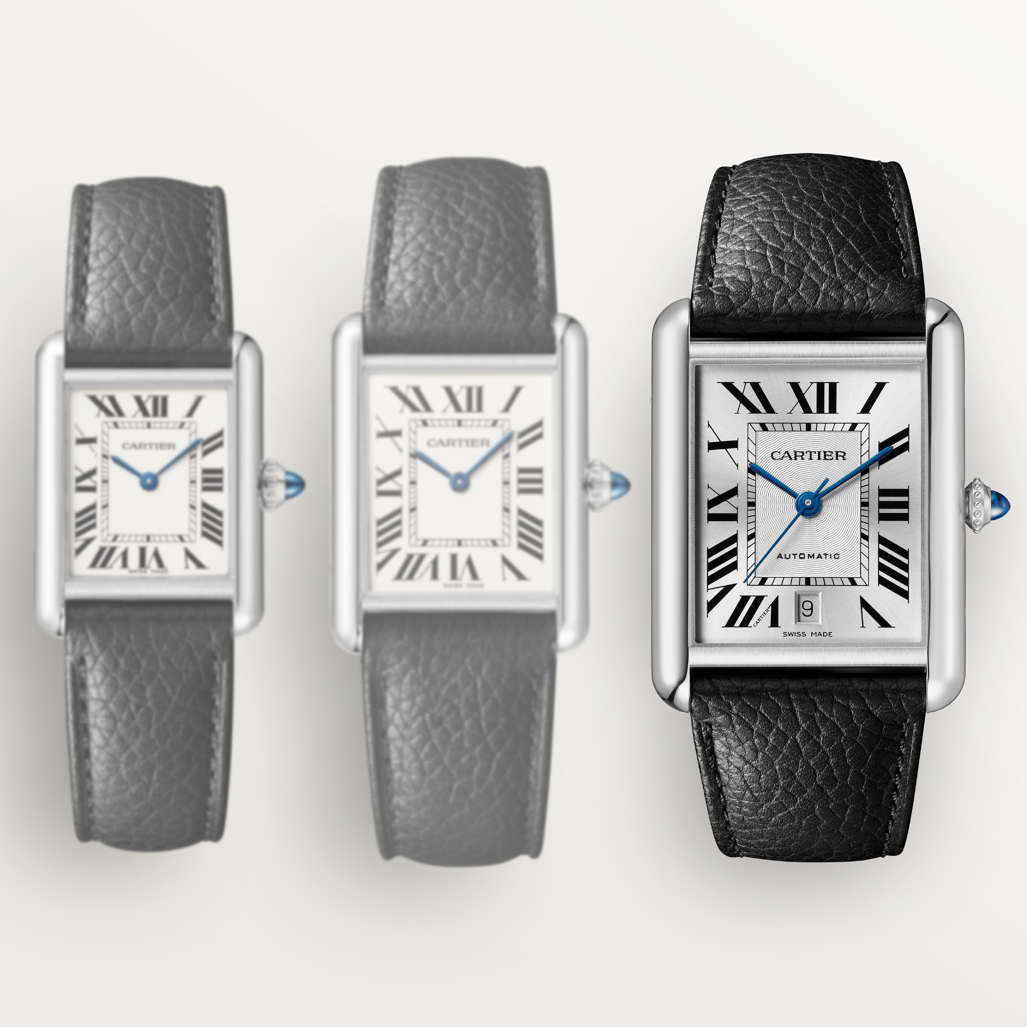 Size & strap comparison: Dupe Tank Must steel watches, featuring an extra-large model with a black leather strap.