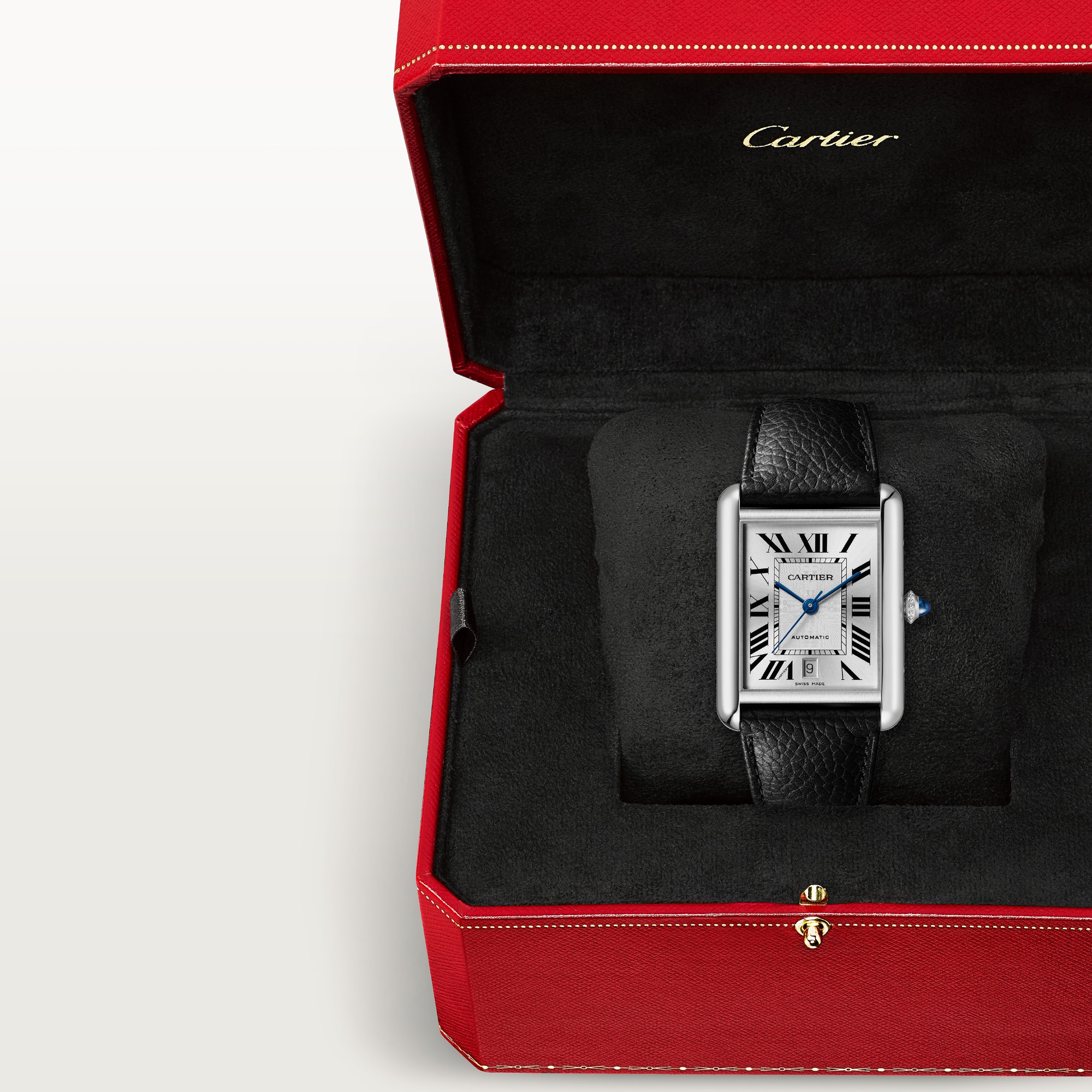 In box: Dupe Tank Must extra-large model watch with steel case and black leather strap, presented in its iconic red brand packaging.