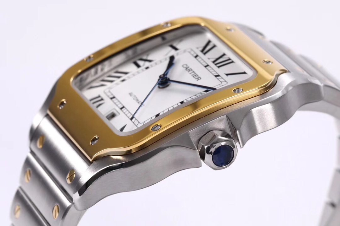 Close-up of the crown on the BVF Super Clone Cartier Santos two-tone case replica watch, featuring the iconic blue gemstone and gold and steel case.