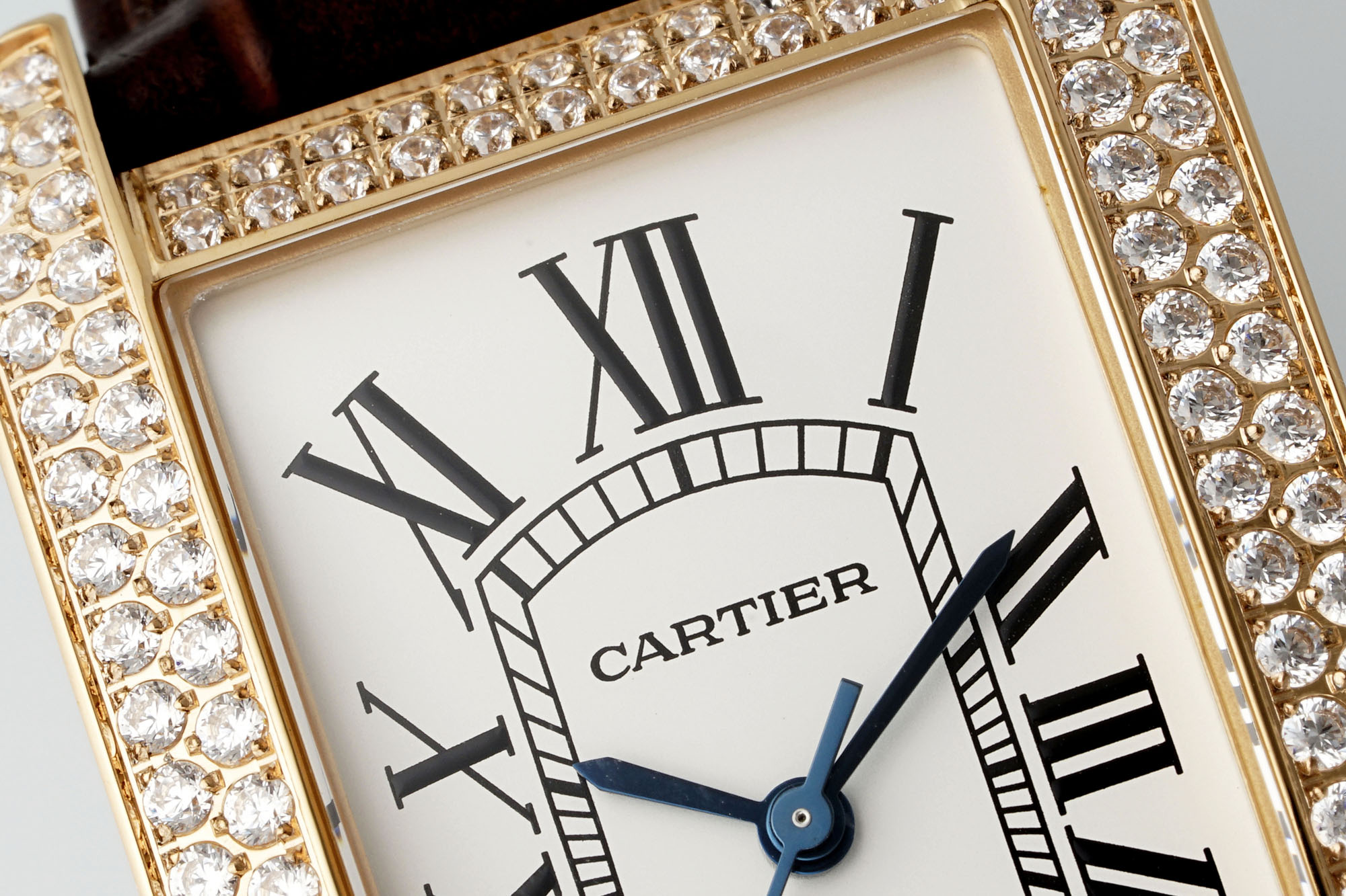 Close-up of the top part of the dial of the AF Super Clone Cartier Tank Américaine rose gold diamond-set replica watch, clearly showing