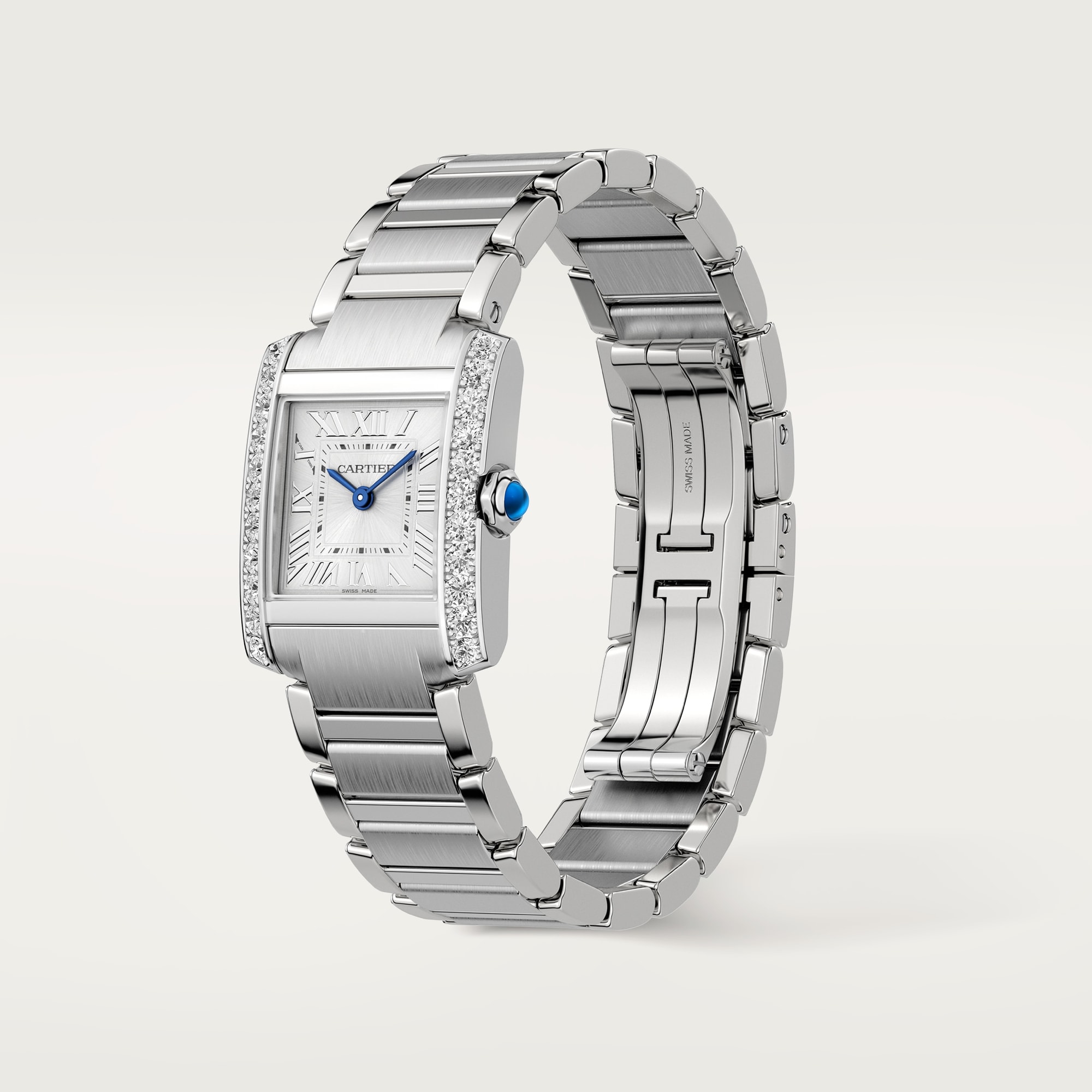 Angled view of a Dupe Tank Française small model watch with a diamond-set steel case, steel bracelet, and folding clasp