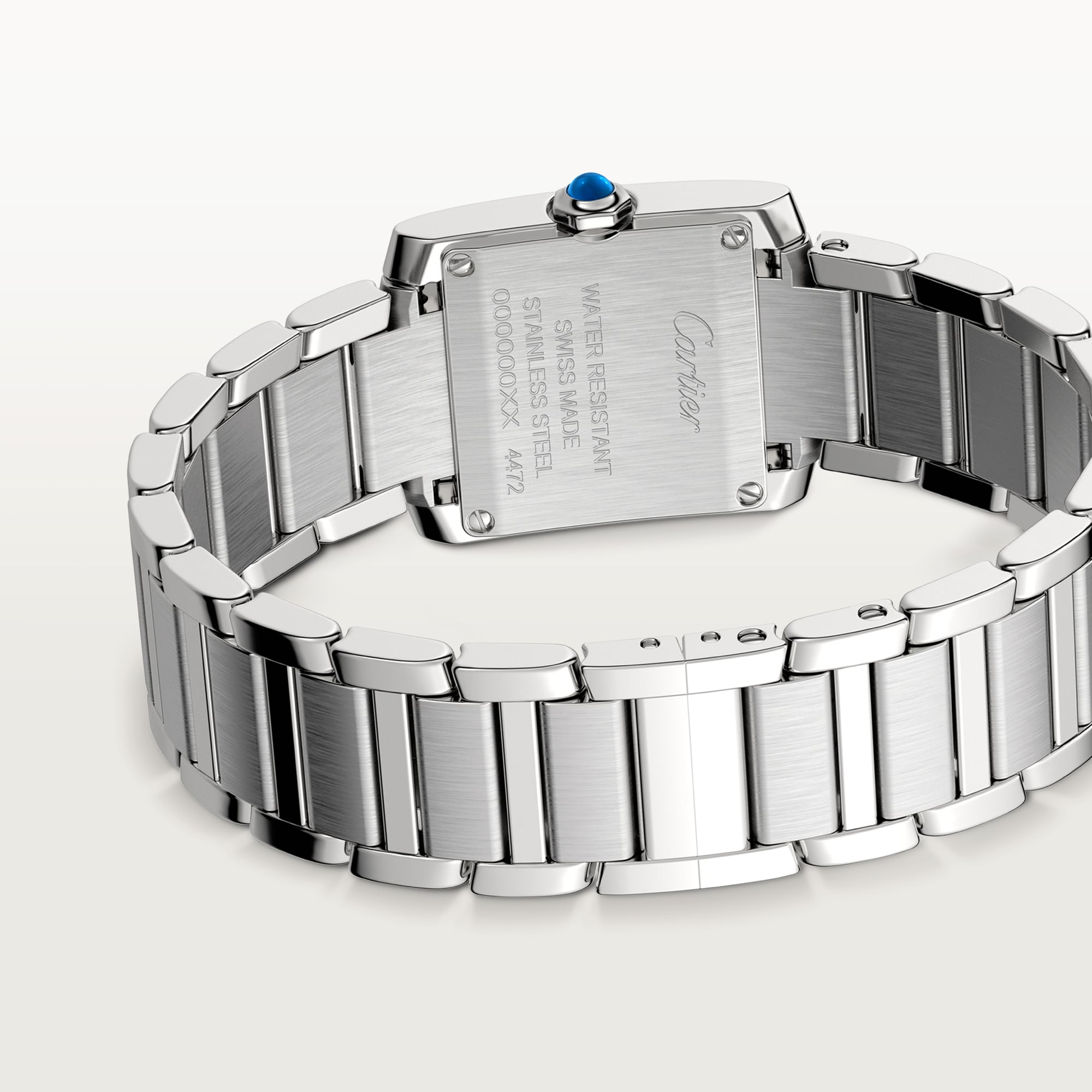 Caseback view of a Dupe Tank Française small model watch in steel, showing brand engravings and part of the bracelet.