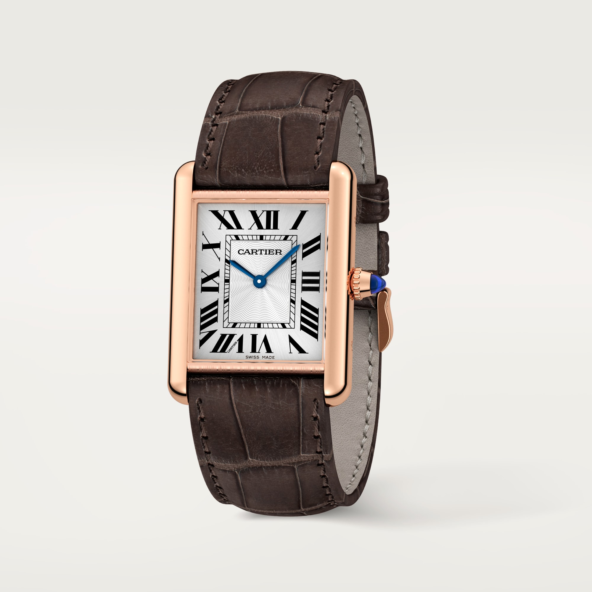 Perspective view of a Dupe Tank Louis Cartier large model watch, rose gold color case paired with a dark brown alligator-patterned leather strap, showcasing style.