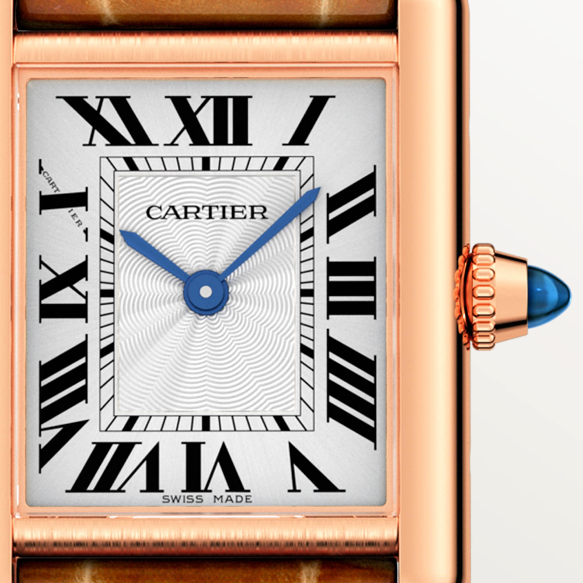 Macro shot of the dial on a Dupe Tank Louis Cartier small model watch with a rose gold case, showing Roman numerals, blue hands, and the crown.