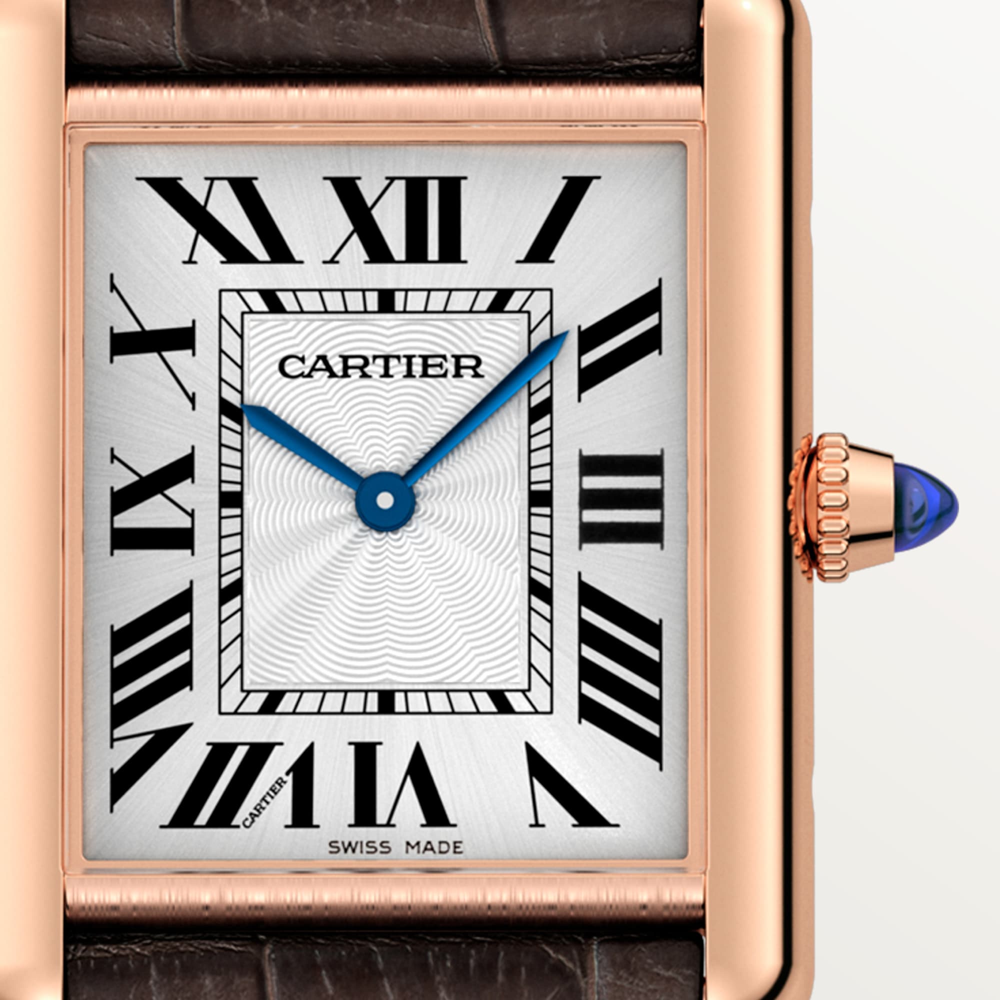 Macro shot of the dial on a Dupe Tank Louis Cartier large model watch with a rose gold color case, showing Roman numerals, blue hands, and the crown.