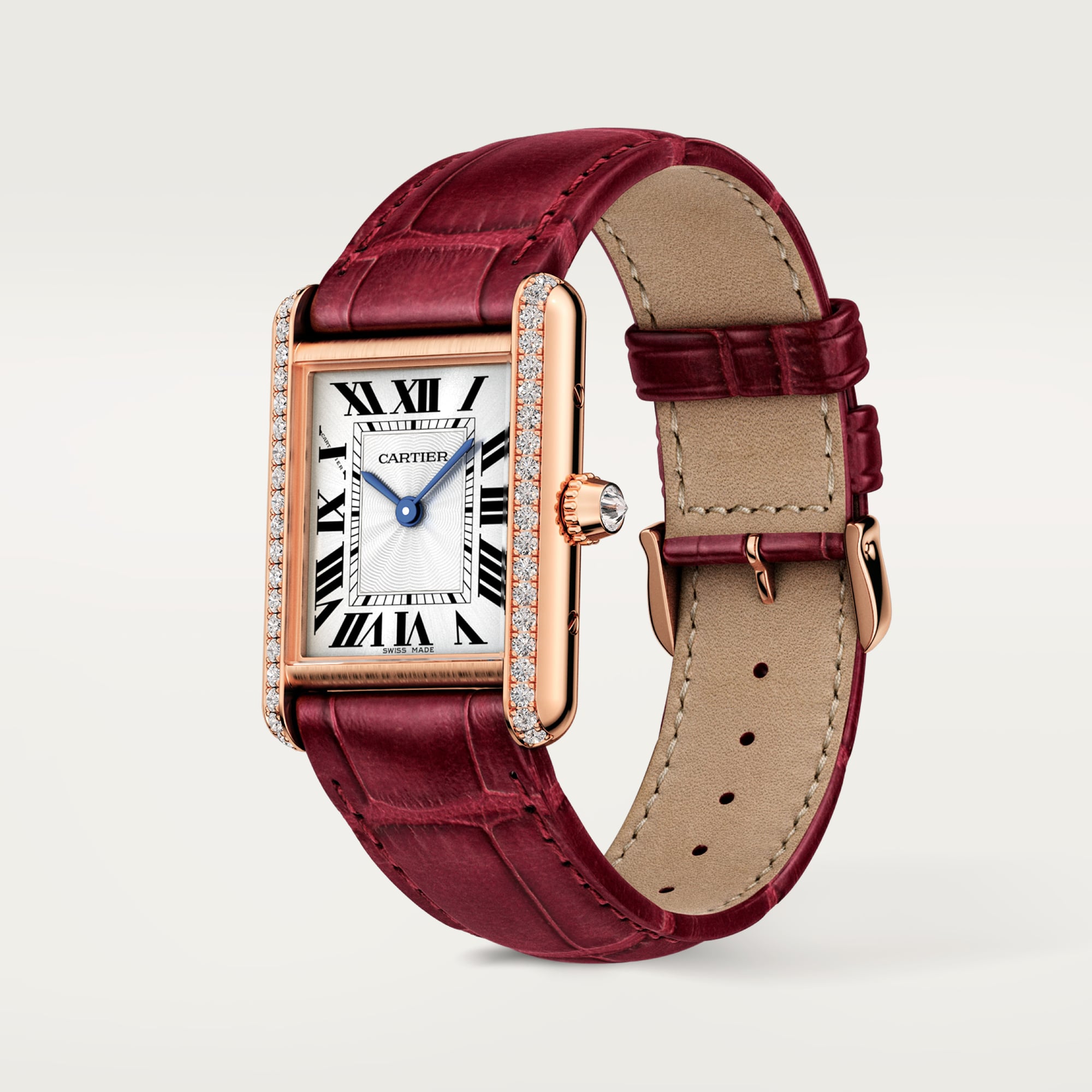 Angled side view: Dupe Tank Louis Cartier small model watch, rose gold diamond-set case, white dial, and burgundy leather strap