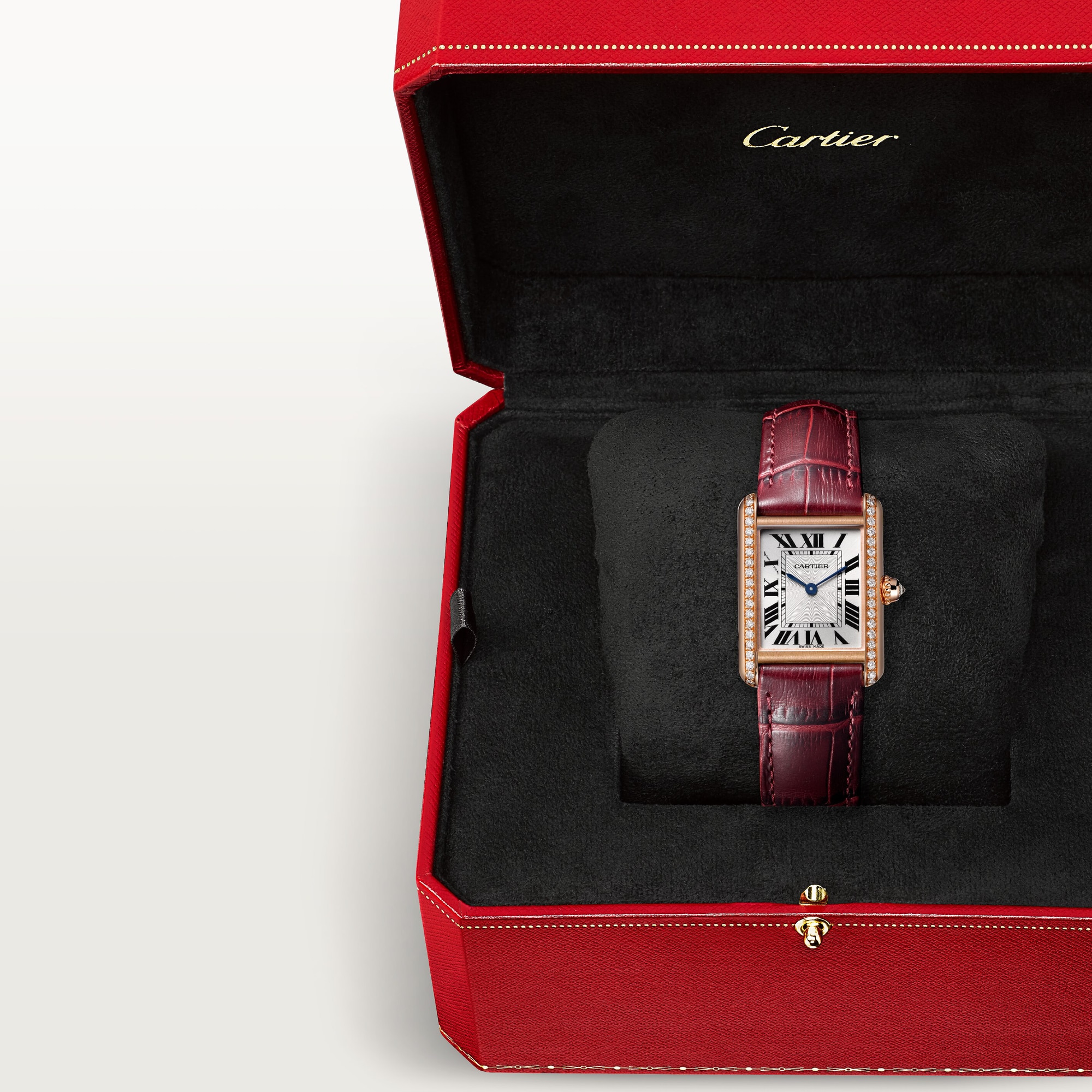In box: Dupe Tank Louis Cartier small model rose gold diamond watch with burgundy leather strap, presented in its iconic red brand packaging.