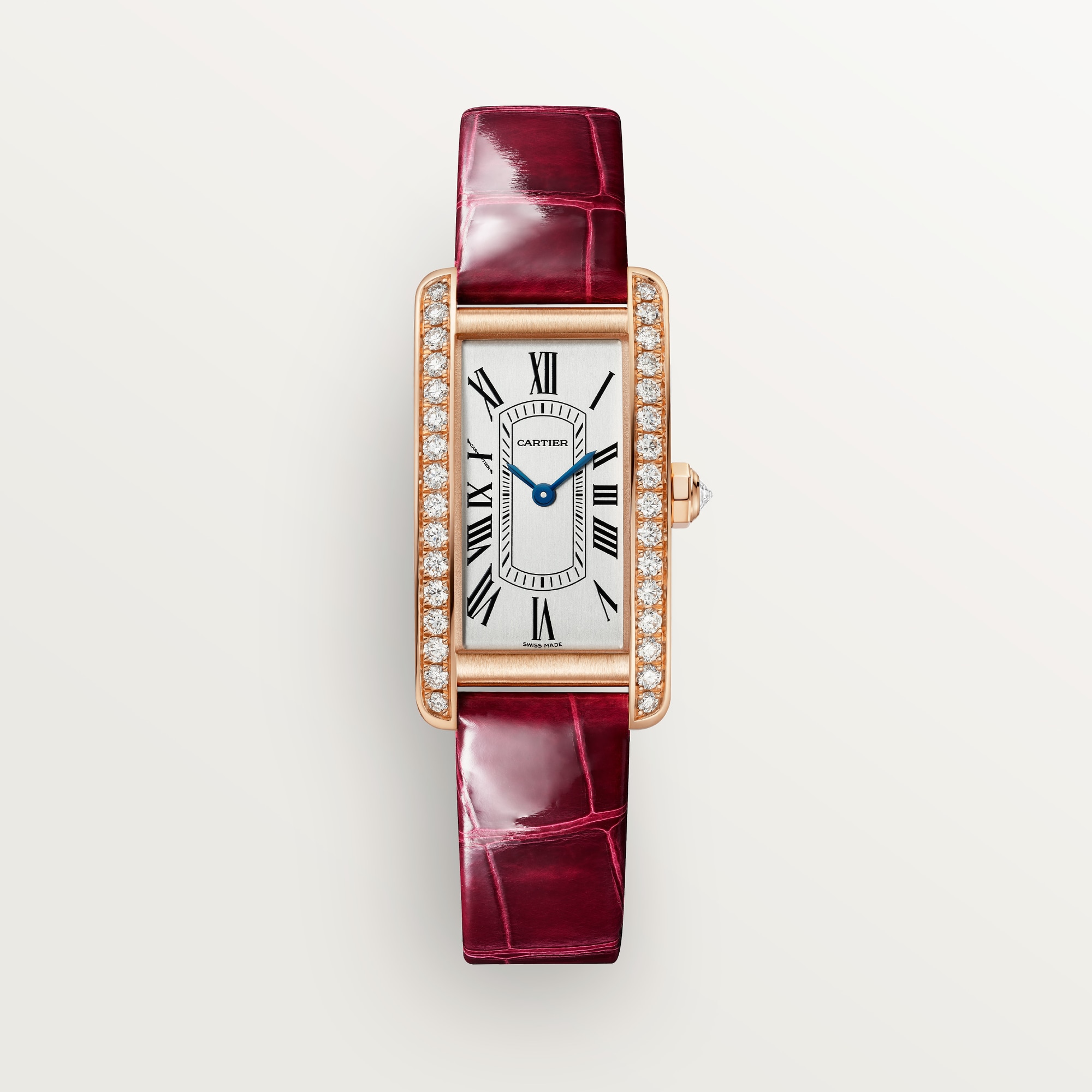 Front view: Dupe Tank Américaine small model watch, rose gold curved case set with diamonds, and burgundy patent leather strap.