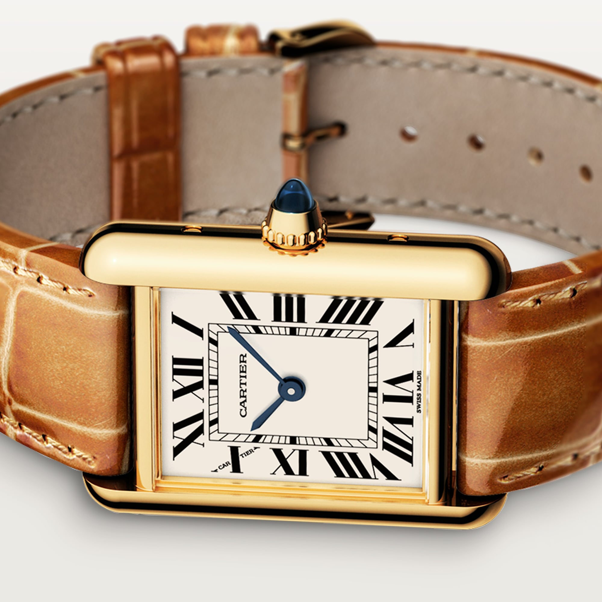 Angled view: Dupe Tank Louis Cartier small model watch, yellow gold colors case, white dial, and brown leather strap, different angle.