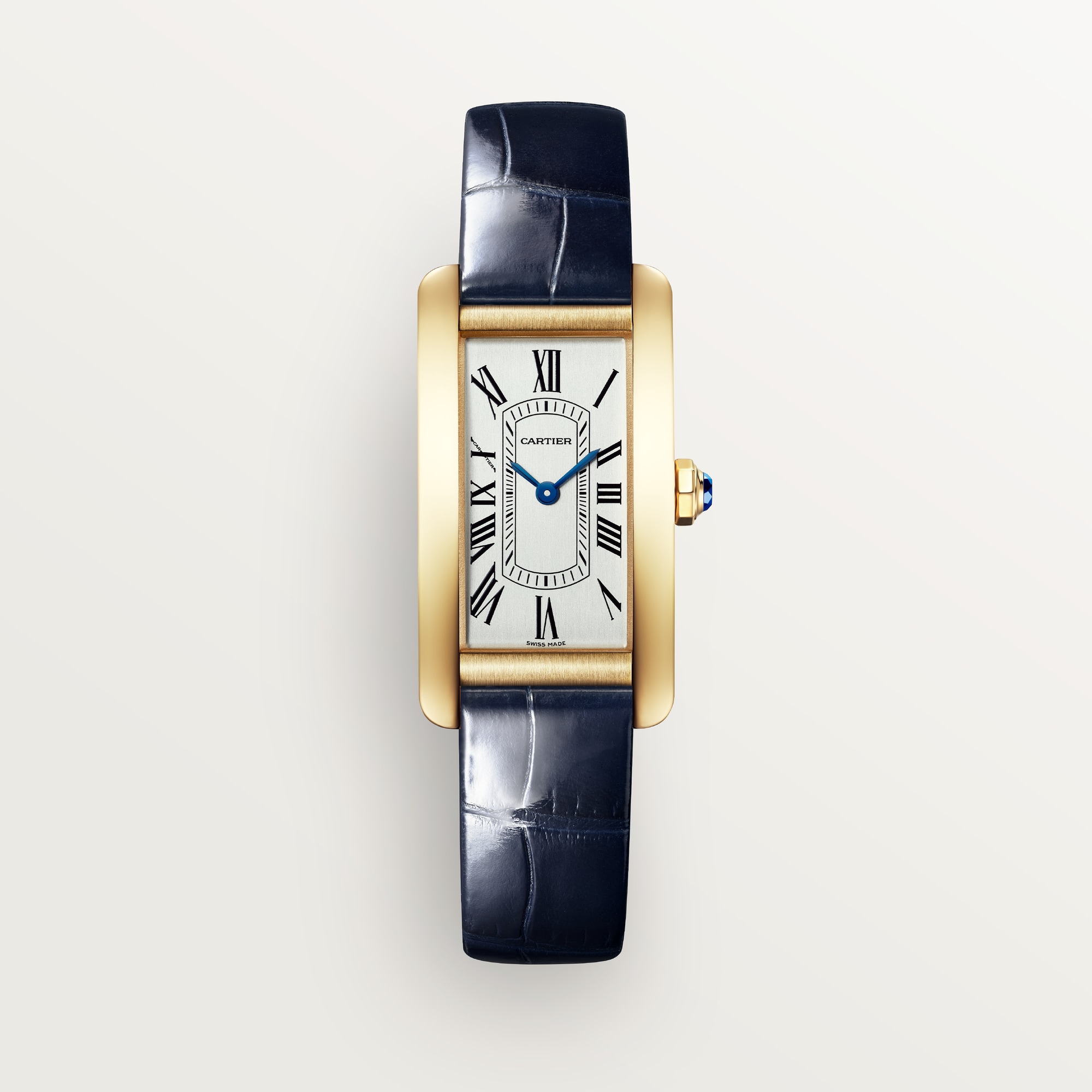 Front view: Dupe Tank Américaine small model watch, yellow gold colors curved case, white dial, and blue patent leather strap.