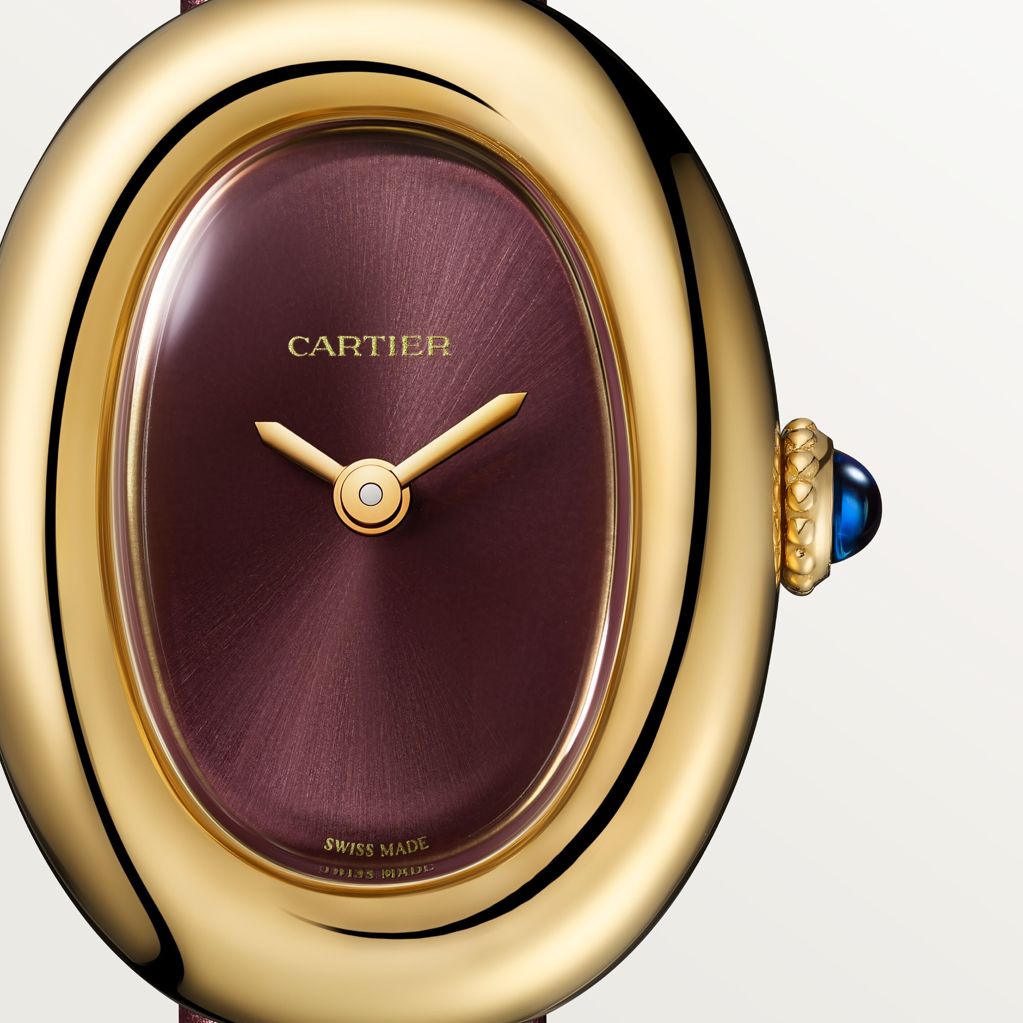 Angled view of the Dupe Baignoire Mini Watch featuring a yellow gold case and burgundy leather strap.