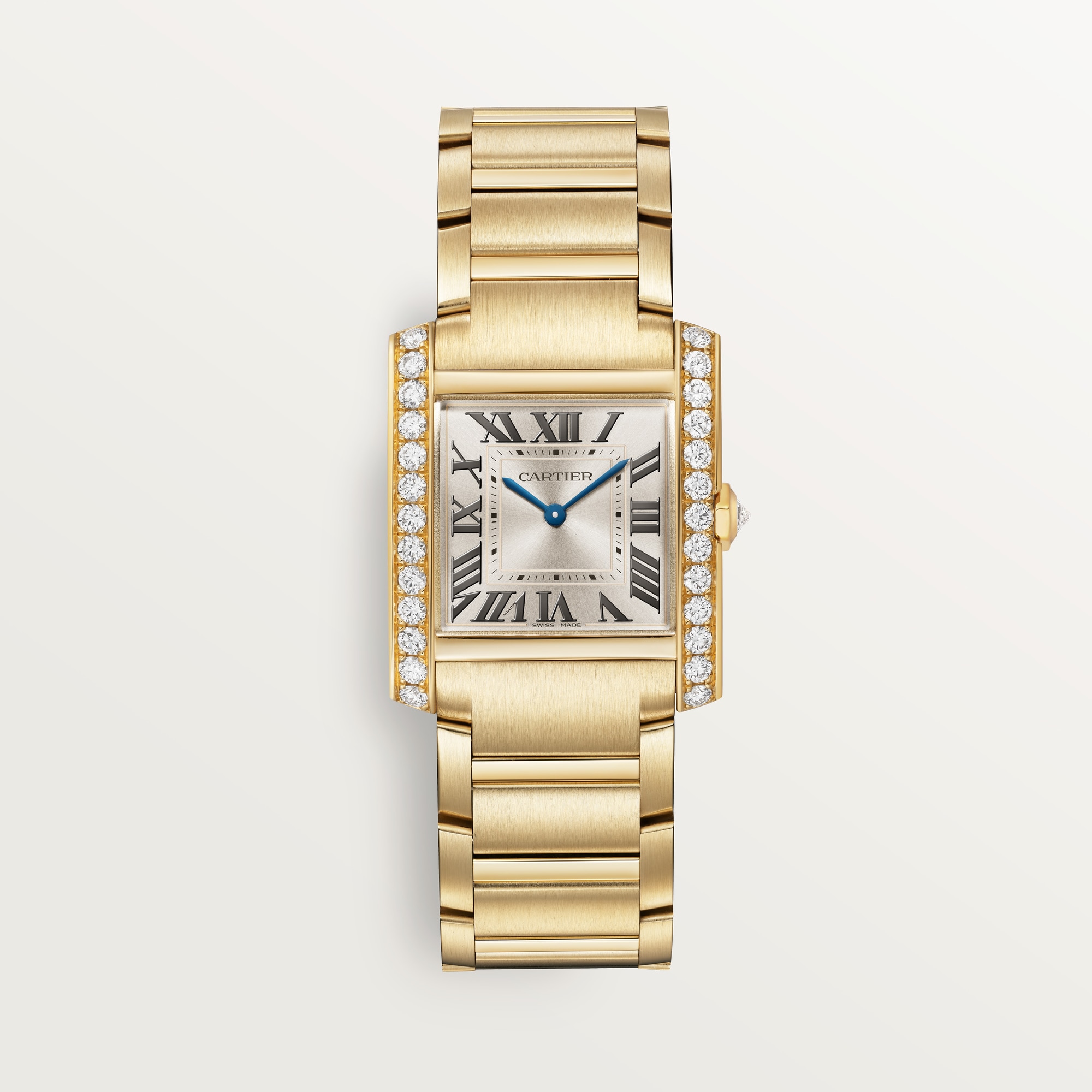 Front view: Dupe Tank Française medium model watch, yellow gold case set with diamonds, white dial, and matching metal bracelet.