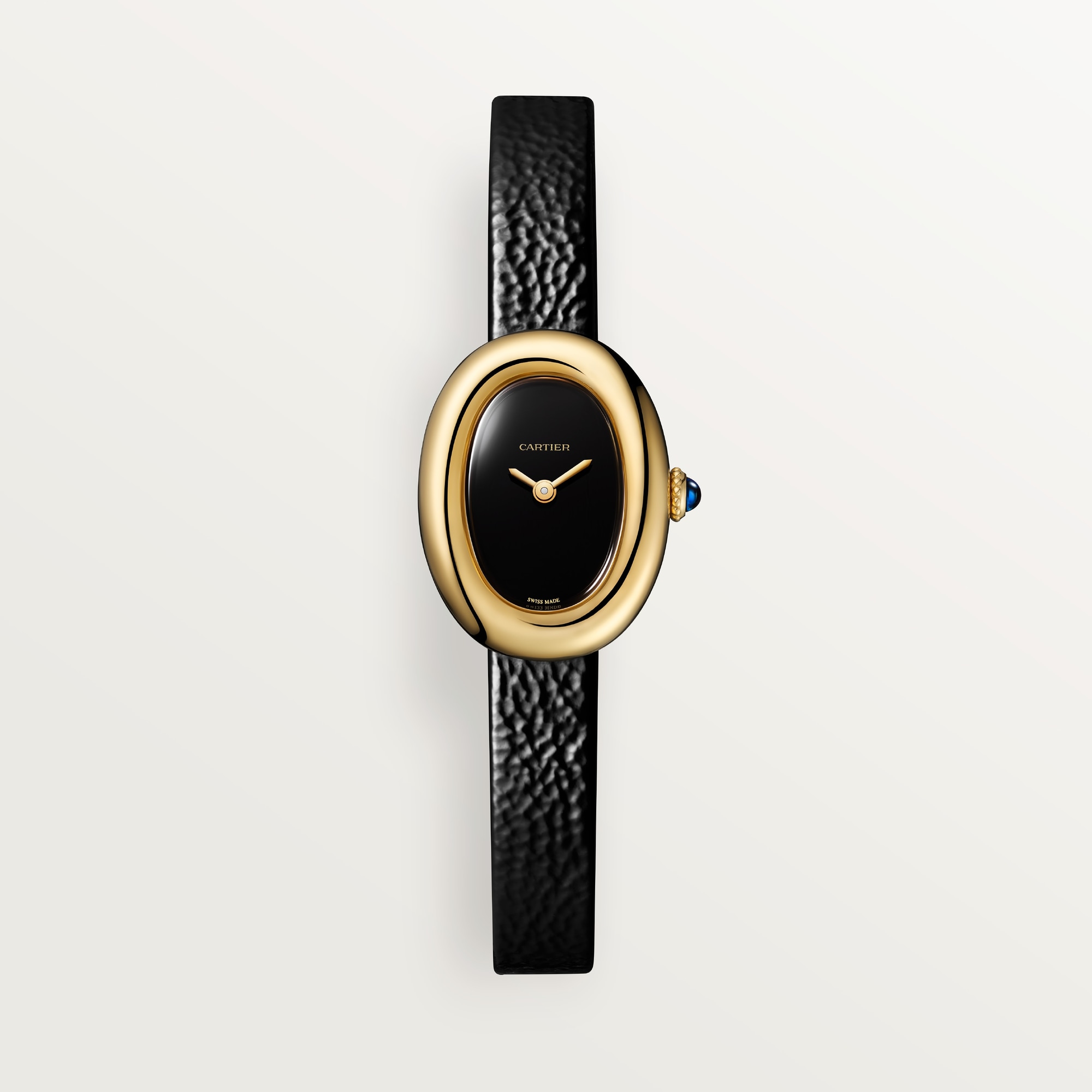 Dupe Baignoire Mini Watch with a yellow gold case and black dial shown on a wrist.