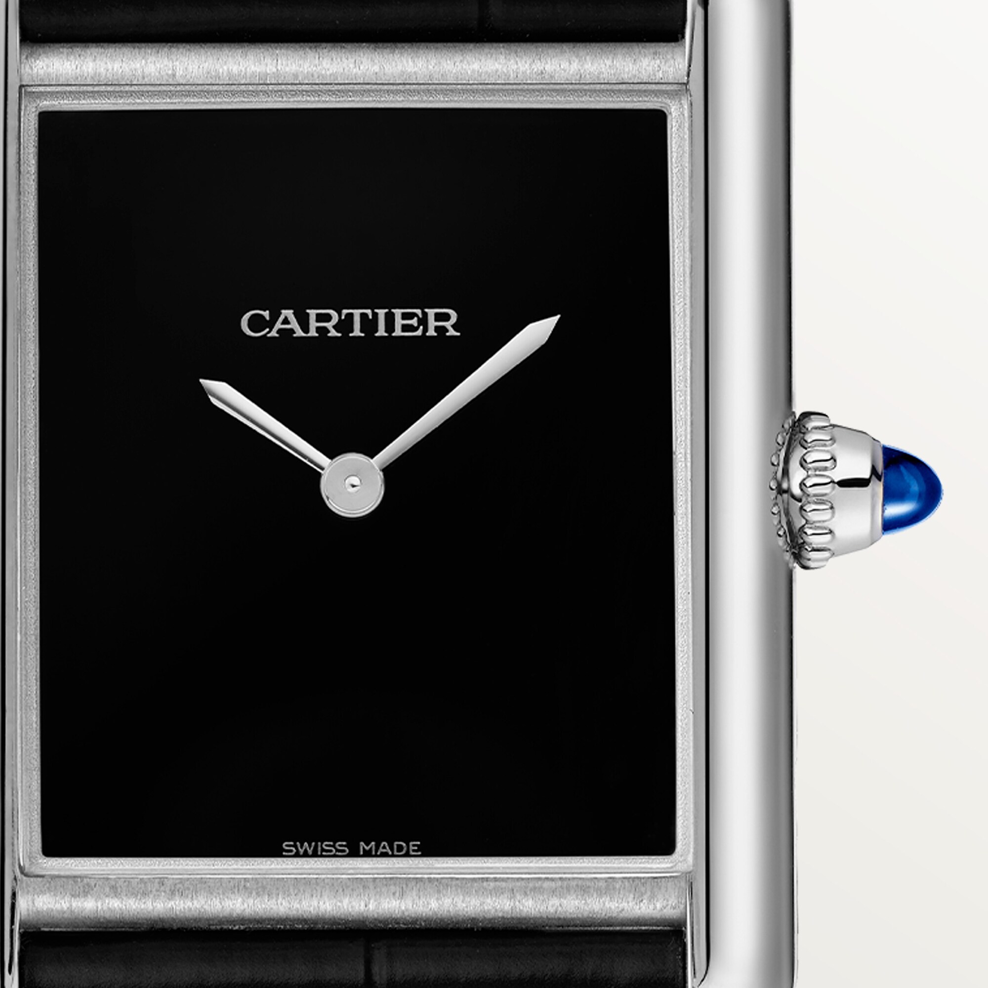 Close-up of the minimalist black dial on a large Tank Must dupe Cartier watch, steel case, with silver hands.