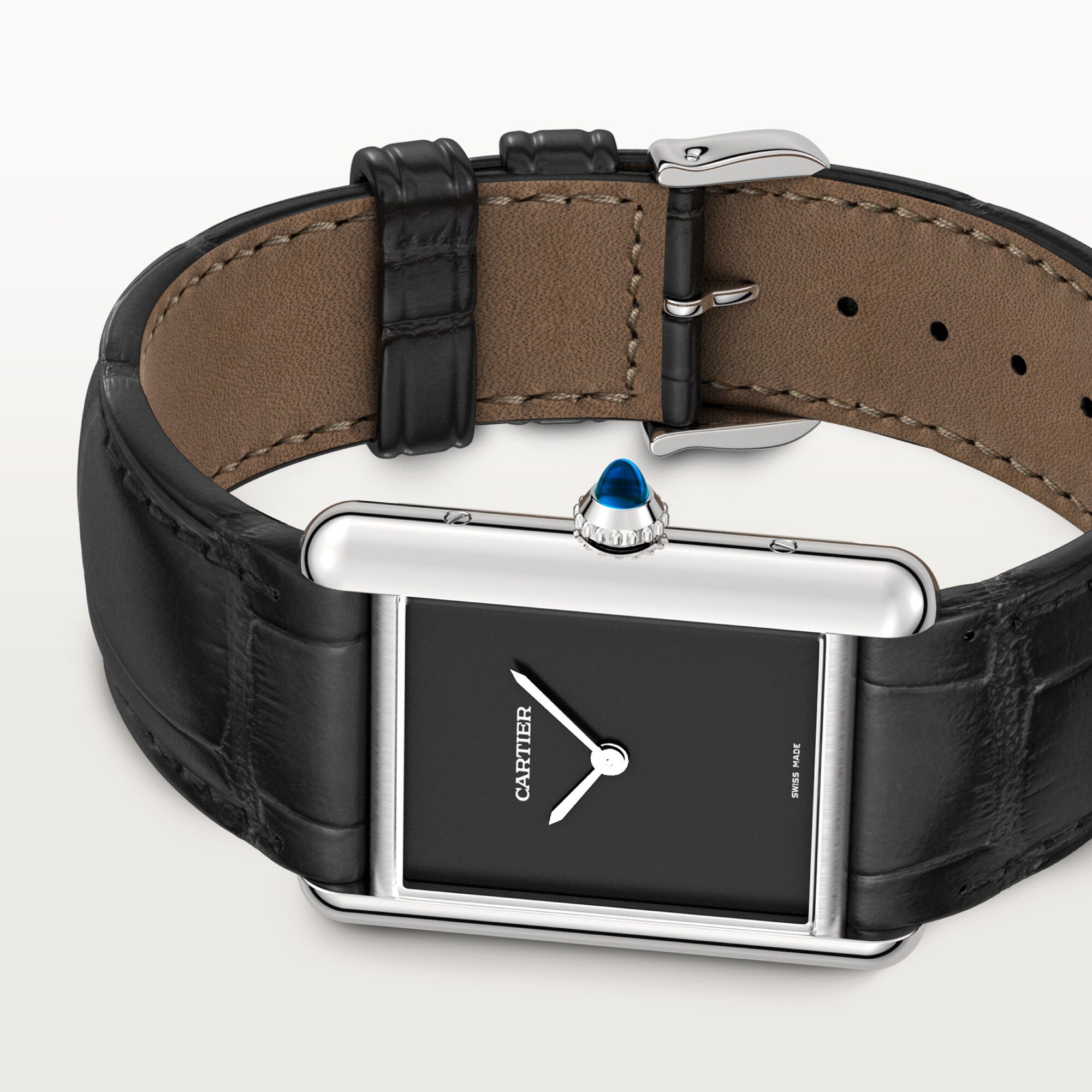 Angled view of a large Tank Must dupe Cartier watch: steel case, black dial, silver hands, and black leather strap.