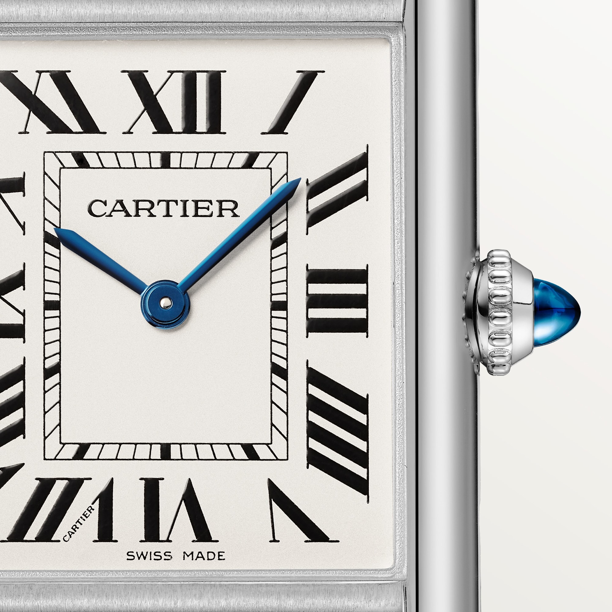Detailed dial of a large Tank Must dupe Cartier watch in steel, with Roman numerals and blue hands.