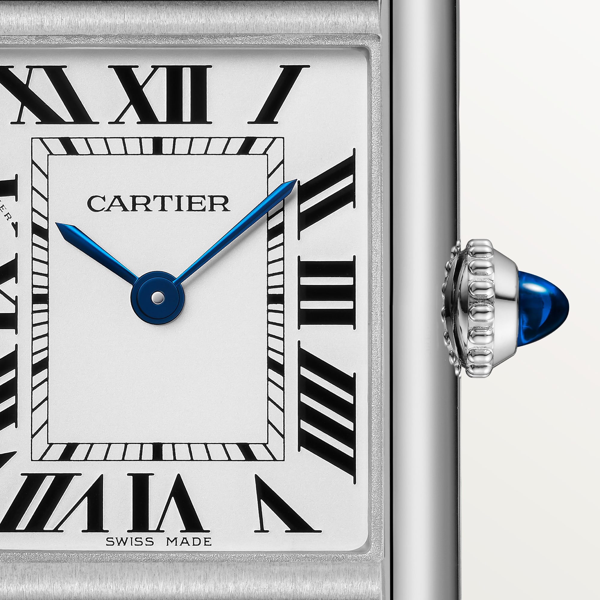 Detailed close-up of the white Roman numeral dial on a small Tank Must Solarbeat™ dupe Cartier watch, steel case, with blue hands.