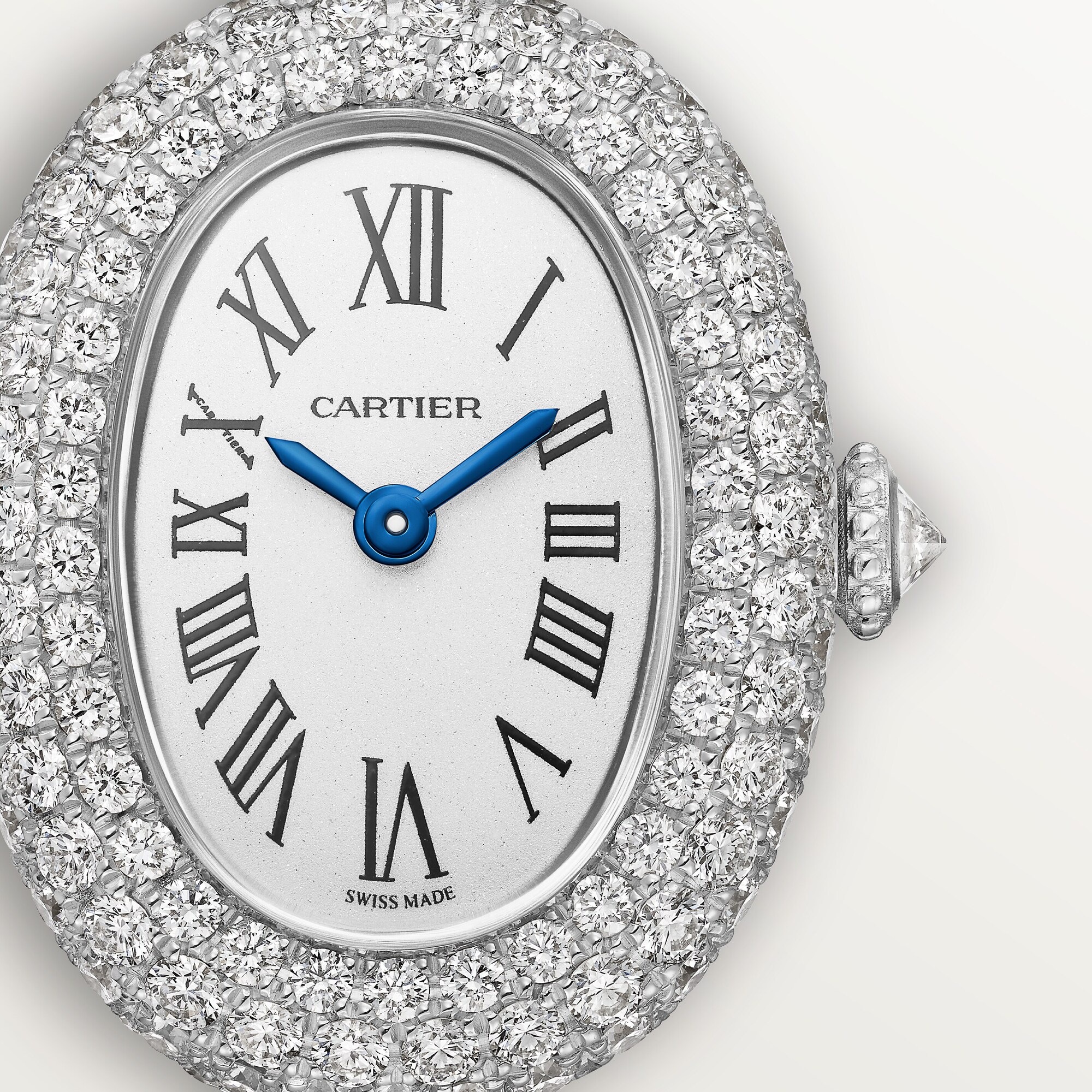 Close-up of the Cartier Baignoire mini white gold diamond watch, showcasing the pave diamond oval case and dial details.