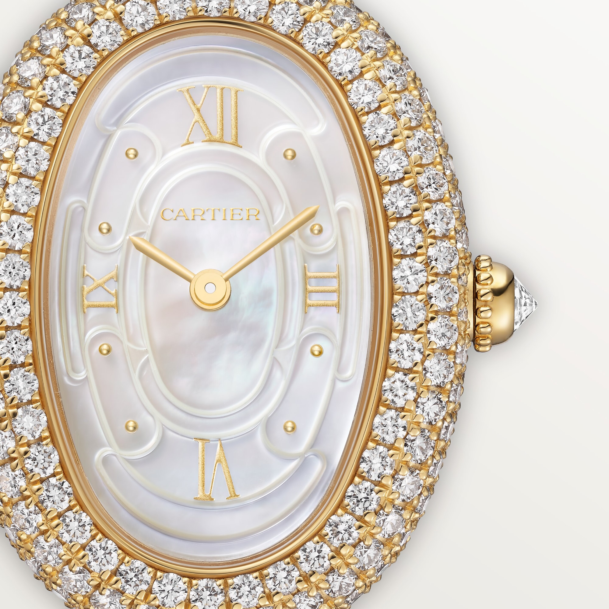 Close-up of the Cartier Baignoire small gold watch, highlighting the diamond-set bezel and mother-of-pearl dial details.