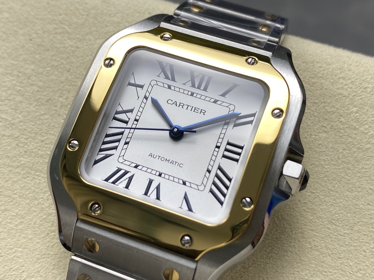 Cartier Santos-inspired watch with a diamond-encrusted case, featuring colorful Roman numeral markers and blue hands. This stunning timepiece combines luxury and sparkle, perfect for those seeking a bold and glamorous style.