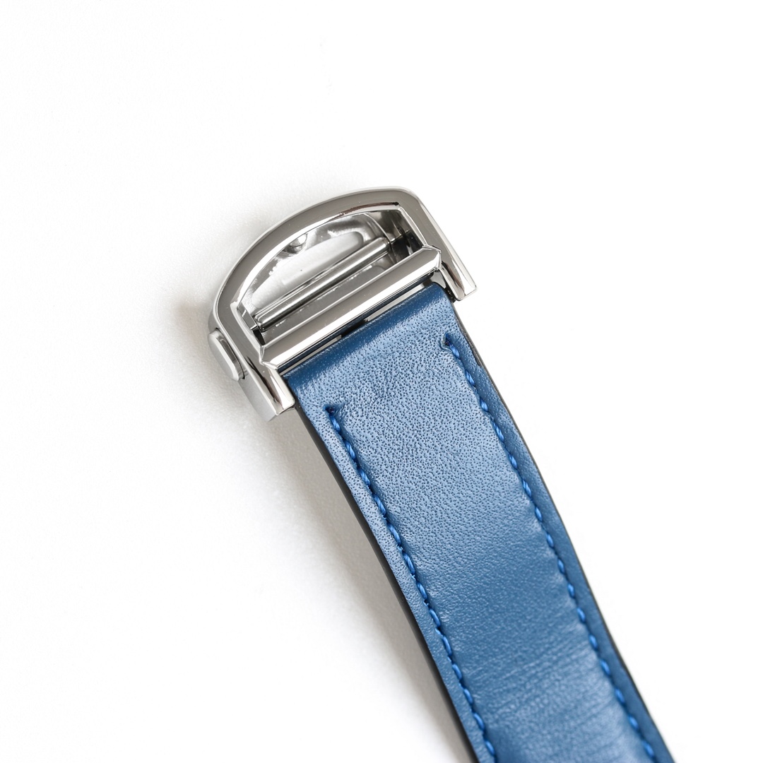 Detail of the silver buckle and blue leather strap of the BVF Super Clone Cartier Santos replica watch.