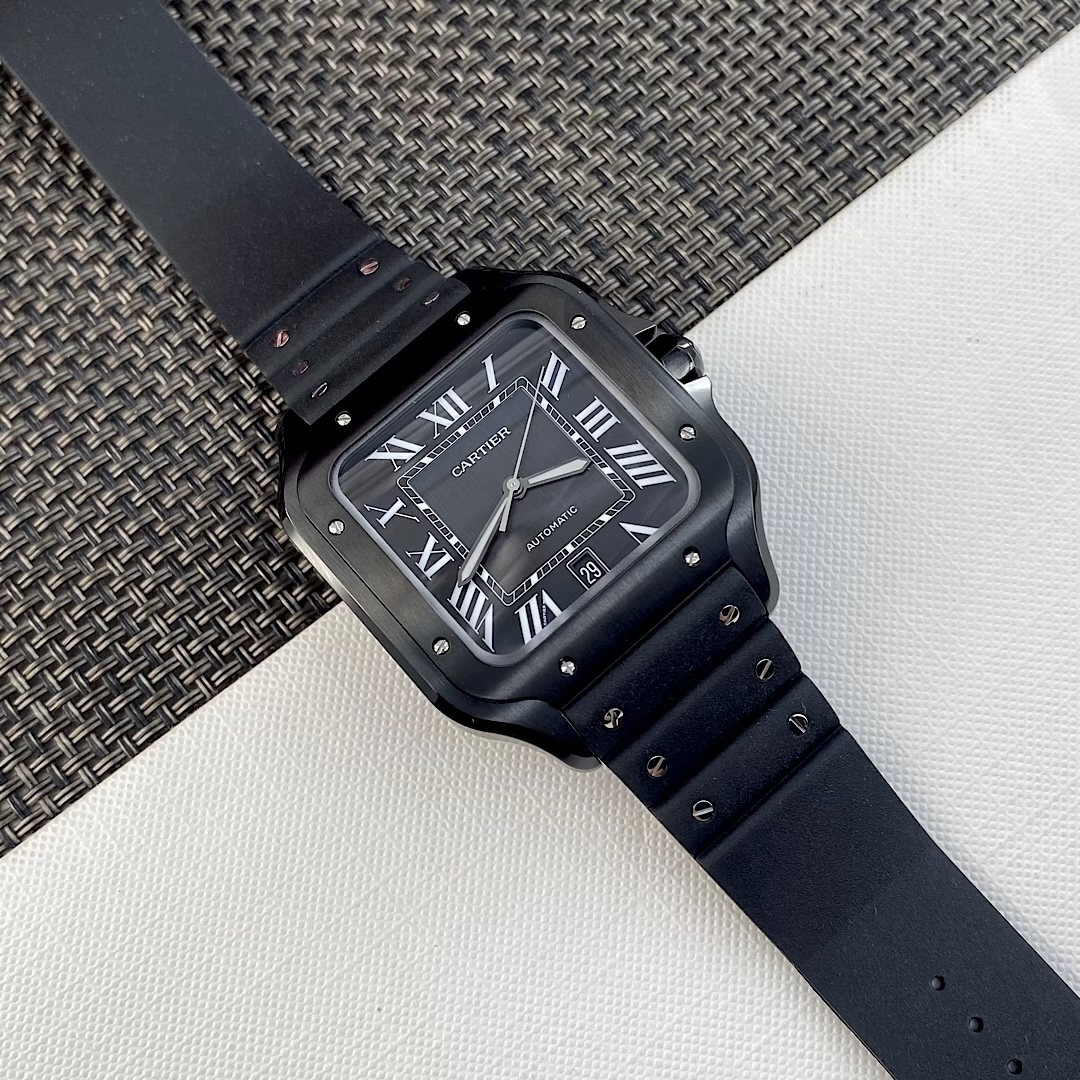 Front close-up of the BVF Super Clone Cartier Santos WSSA0039 black case replica watch, highlighting the black dial, Roman numeral markers, date window, and rubber strap details.