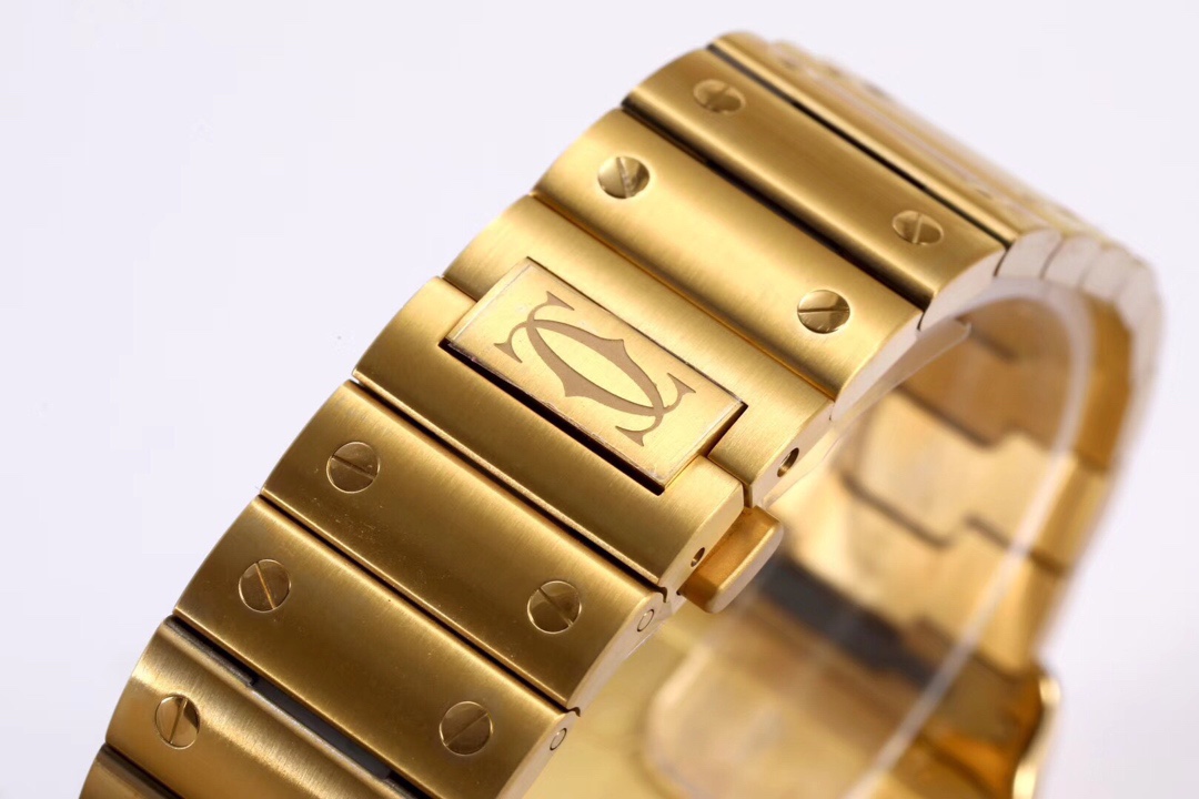Close-up of the clasp on the BVF Super Clone Cartier Santos replica watch's gold and steel bracelet, featuring the Cartier logo.