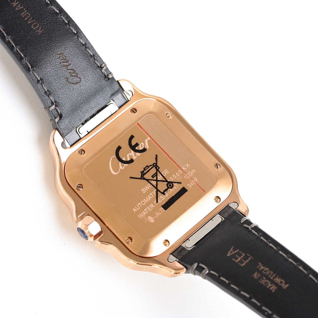 View of the caseback of the BVF Super Clone Cartier Santos rose gold replica watch, showing engravings and the black leather strap.