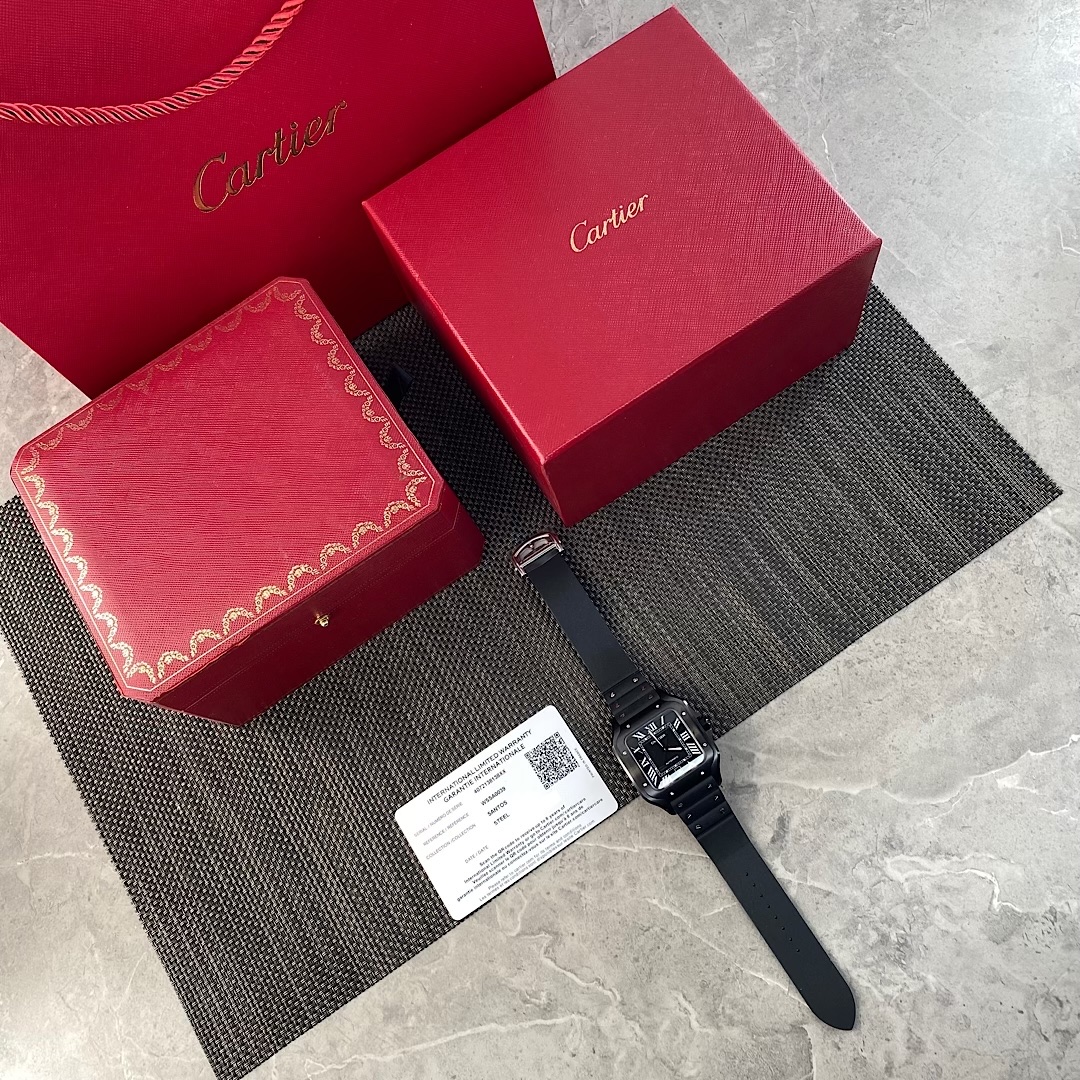 Complete set of the BVF Super Clone Cartier Santos WSSA0039 black case replica watch, including the watch, red gift box, watch box, and warranty card/certificate, showcasing its exquisite packaging.