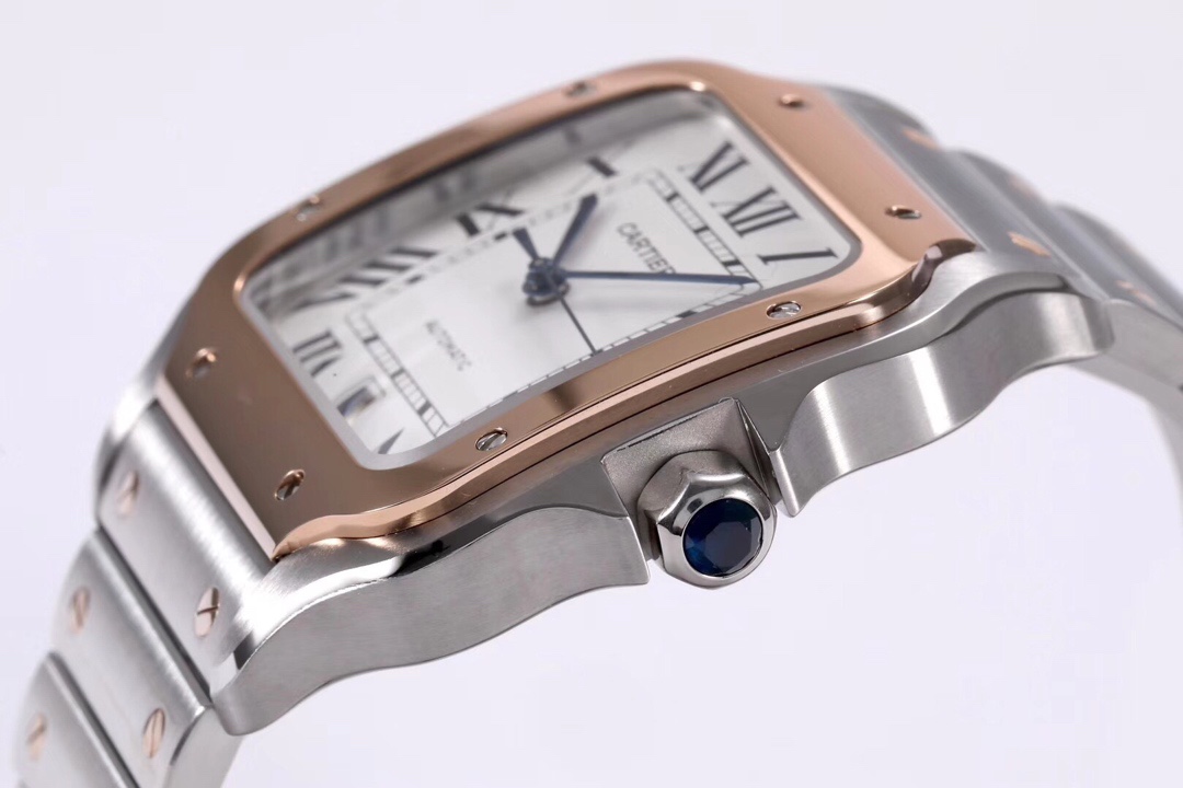 Close-up of the crown on the BVF Super Clone Cartier Santos rose gold and steel two-tone replica watch, featuring the iconic blue gemstone and rose gold and steel case.