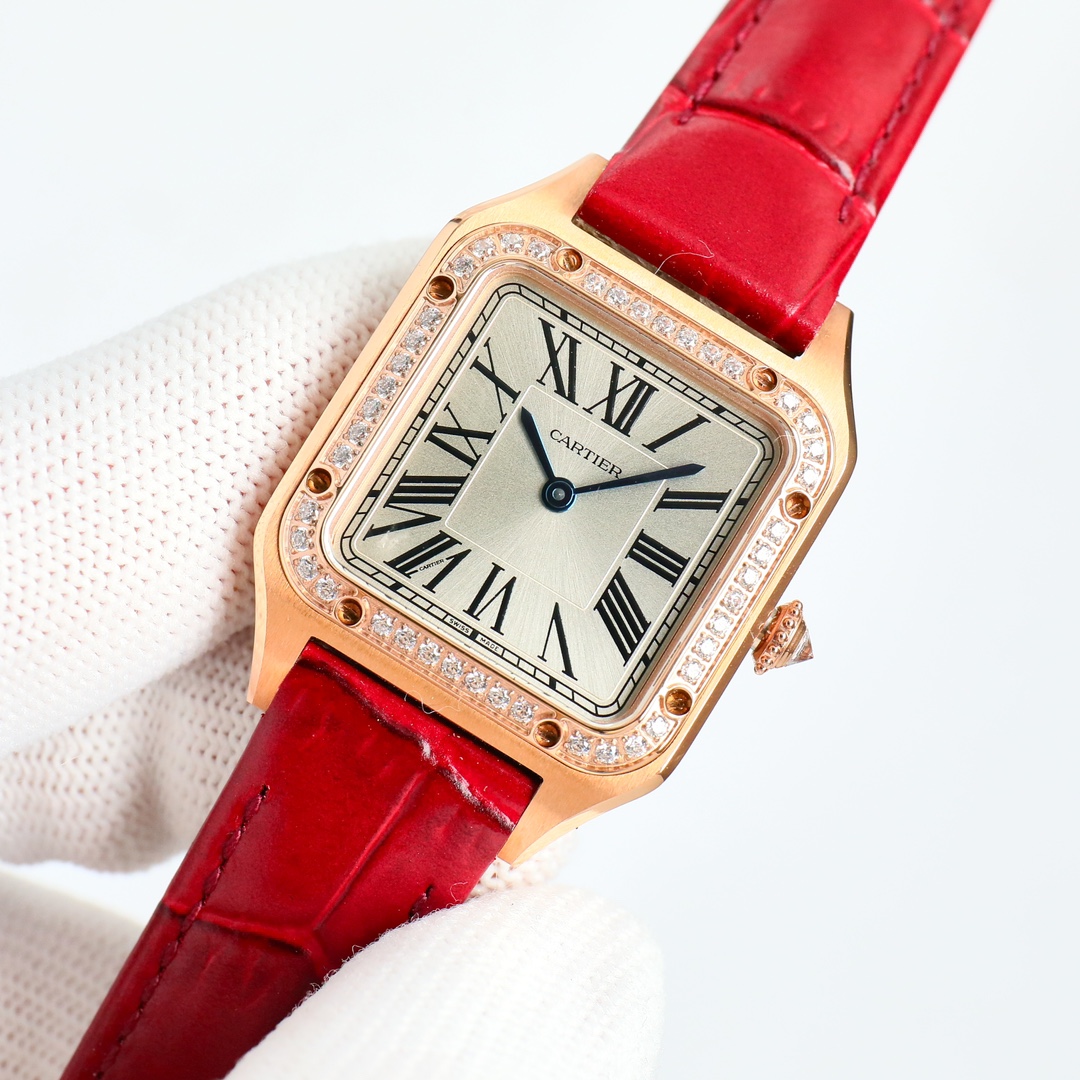 Timeless elegance with a bold splash of color. ❤️ This beautiful Cartier Santos-Dumont with a diamond bezel and vibrant red strap is a true showstopper.