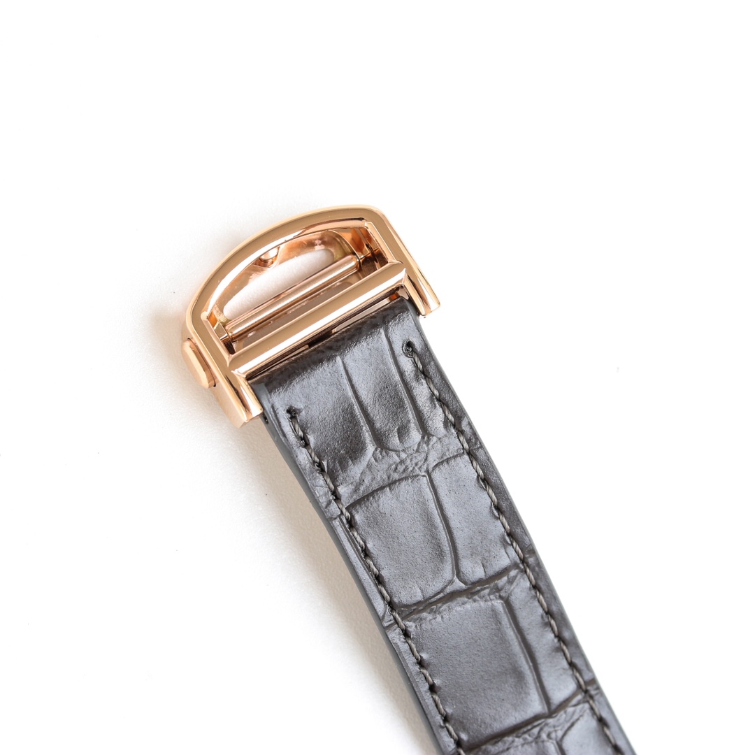 Detail of the black leather strap and pin buckle of the BVF Super Clone Cartier Santos rose gold replica watch.