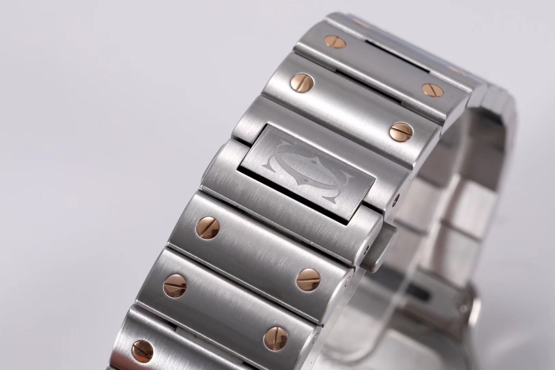 Close-up of the clasp on the BVF Super Clone Cartier Santos rose gold and steel two-tone replica watch's steel bracelet, featuring the Cartier logo.