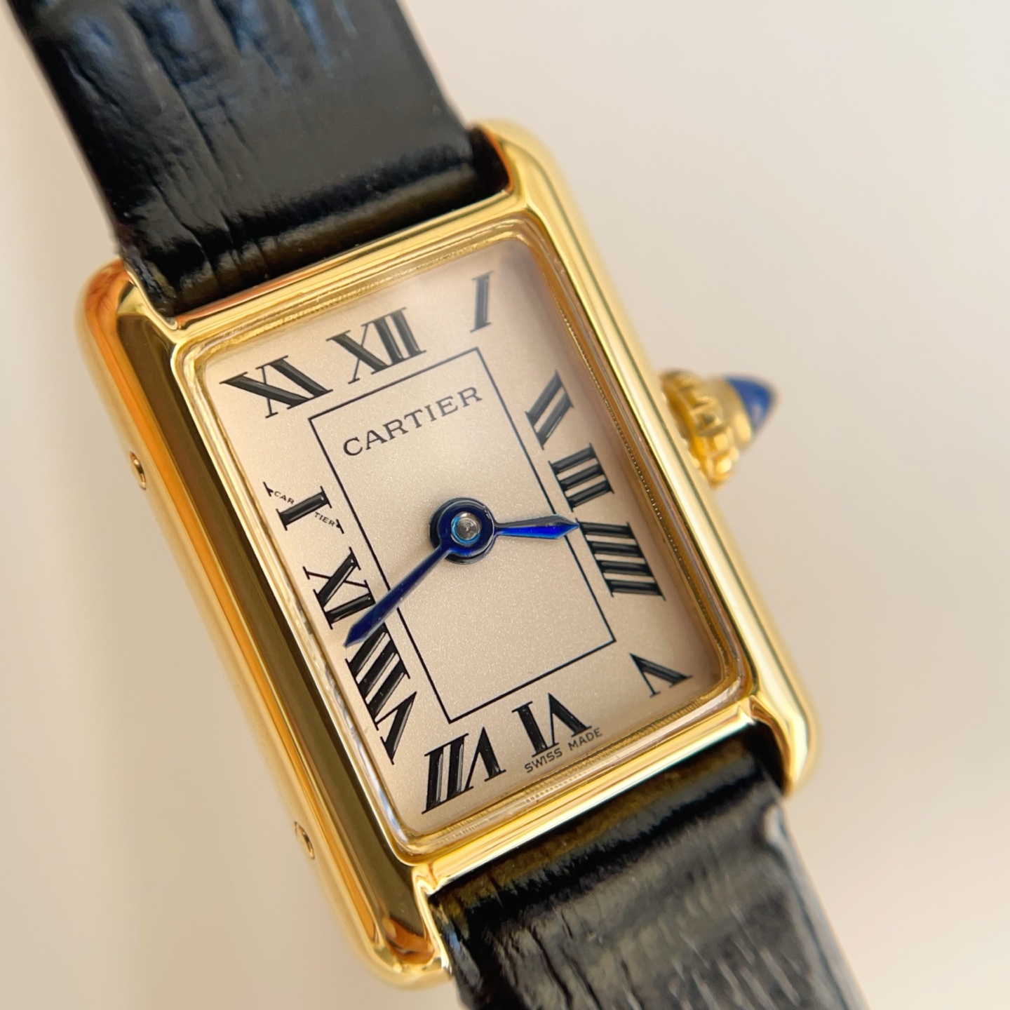 Angled view of the AF Super Clone Cartier Tank Louis replica watch, highlighting the cream dial and blue hands.