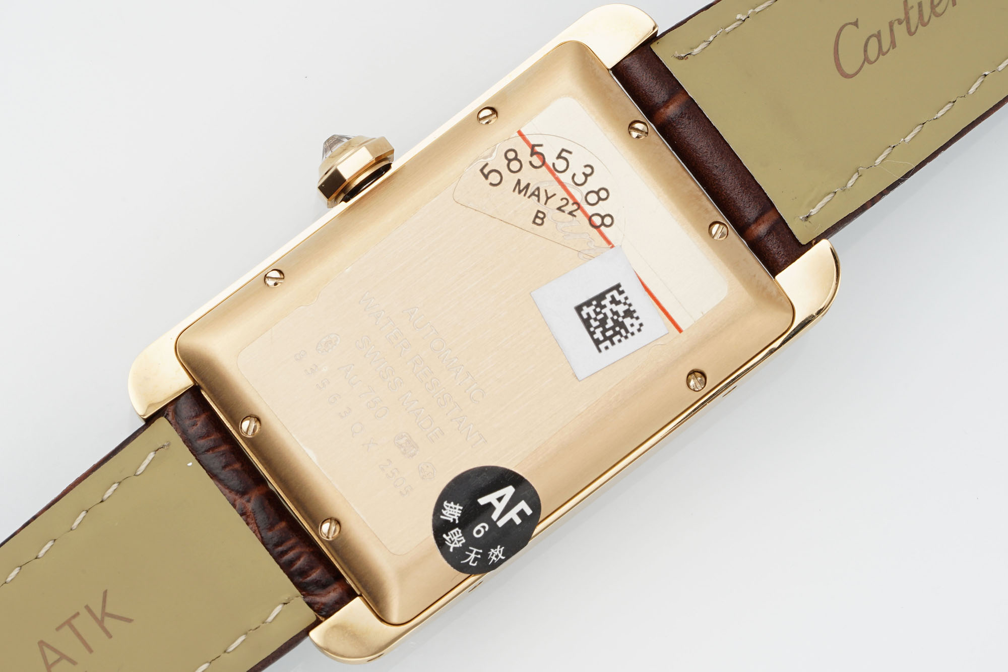 Caseback view of the AF Super Clone Cartier Tank Américaine rose gold diamond-set replica watch, showing the rose gold back and brown leather strap.