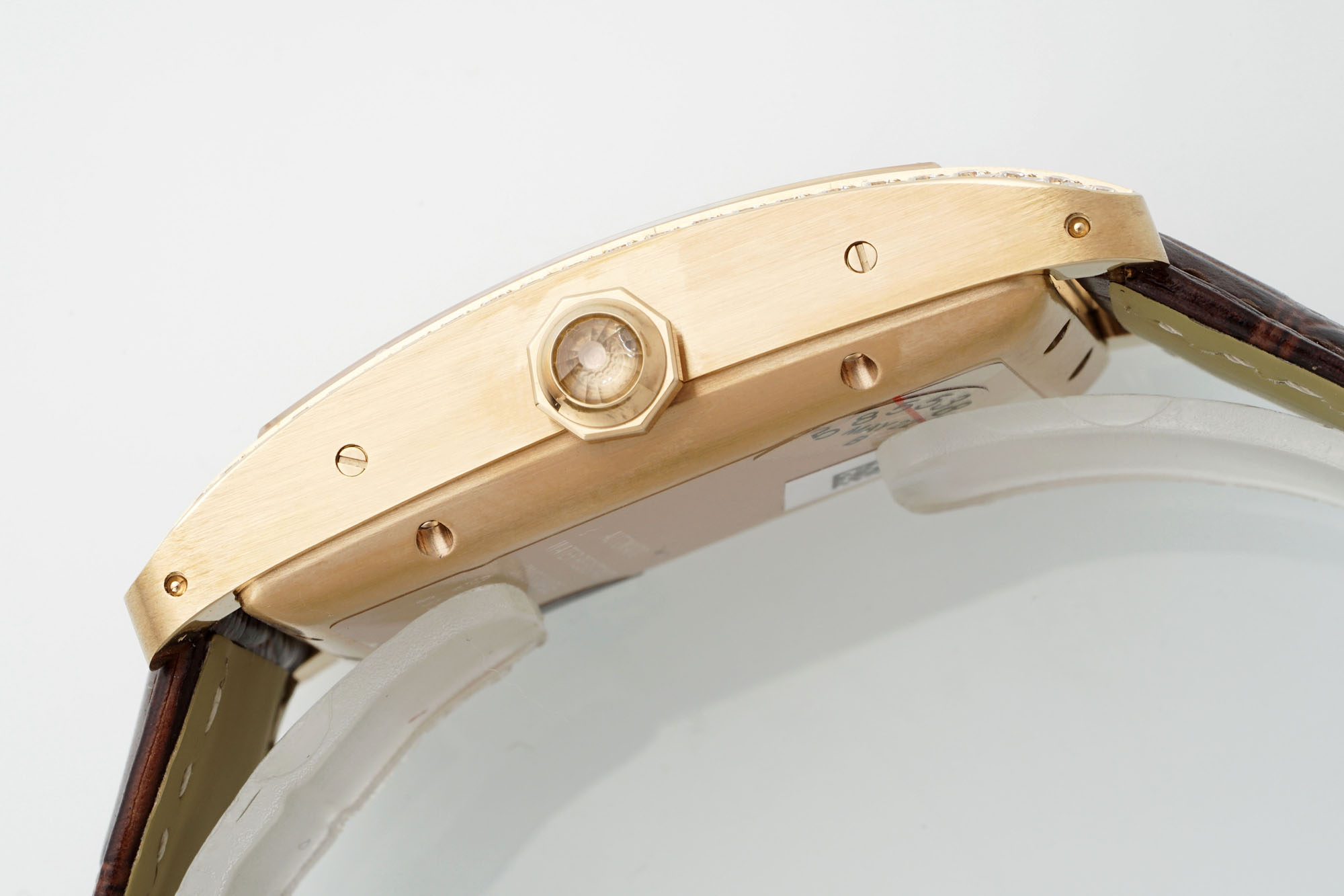 Side view of the AF Super Clone Cartier Tank Américaine rose gold diamond-set replica watch, with a close-up of the crown and rose gold case.