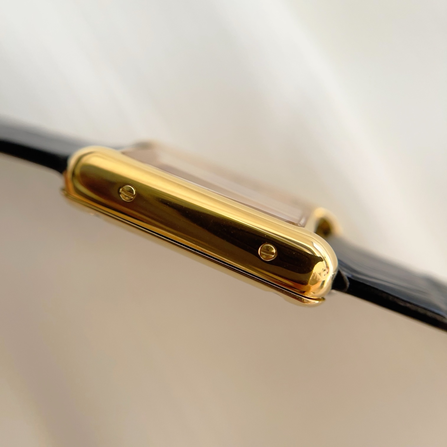 Side view of the AF Super Clone Cartier Tank Louis replica watch, showcasing the refined craftsmanship of the gold case.