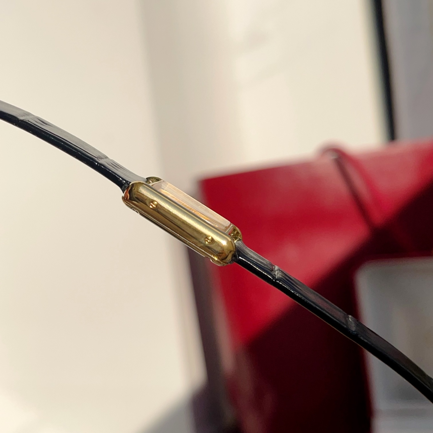 Close-up of the strap connection on the AF Super Clone Cartier Tank Louis replica watch.