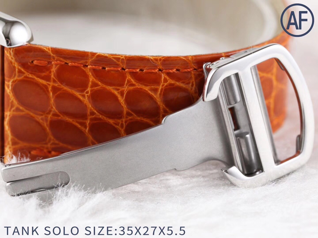 Close-up of the orange leather strap and silver buckle of the AF Super Clone Cartier Tank Solo replica watch.