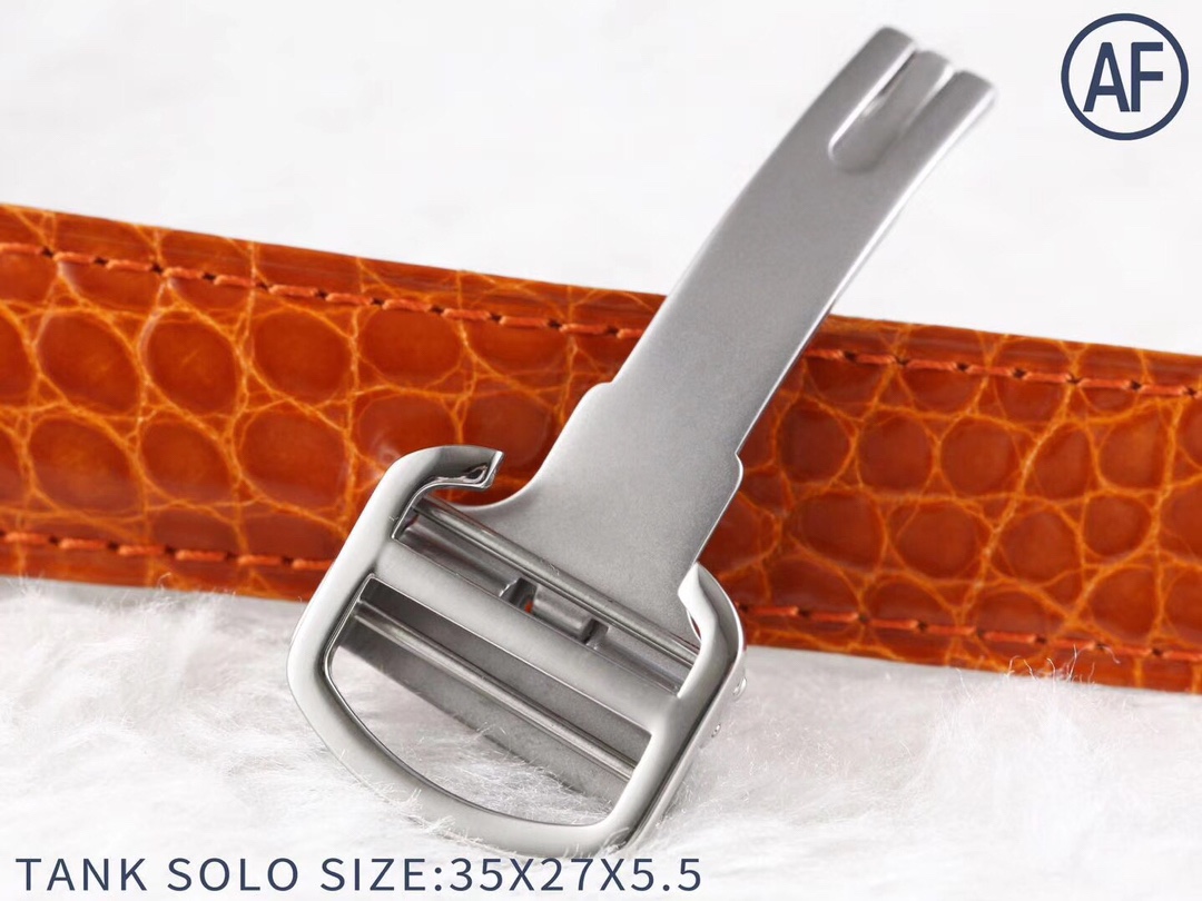 Another close-up of the orange leather strap and silver buckle of the AF Super Clone Cartier Tank Solo replica watch.