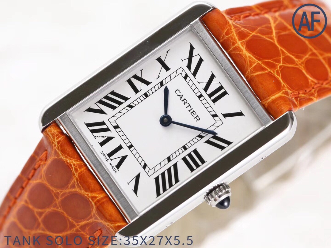 Angled view of the AF Super Clone Cartier Tank Solo silver case replica watch, showcasing the white dial and orange leather strap.