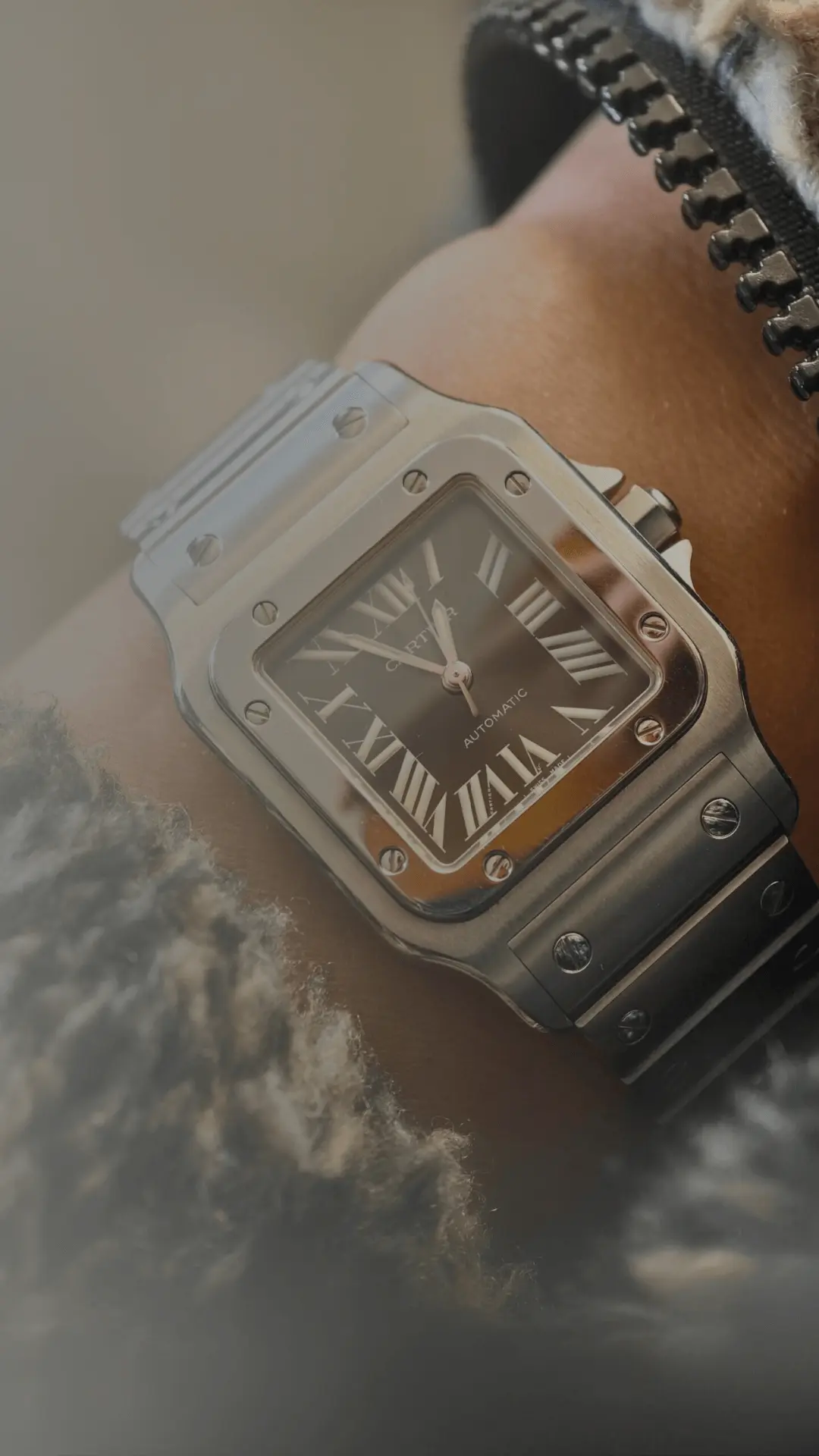 Close-up of a silver Cartier Santos watch dupe on a wrist, perfect Cartier watch alternative for mobile users.