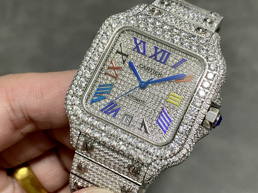 A detailed close-up of a custom bustdown Cartier Santos de Cartier watch. This fully iced-out model features pavé diamonds on the case, bracelet, and dial, with unique multi-color Roman numerals, representing a top luxury watch style for 2025.